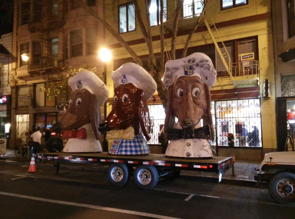 The Doggies welcome guests to The Emperor's 197th Birthday, as the festivities get underway at 518 Valencia, just behind them. PHOTO: Mark Hogan. 