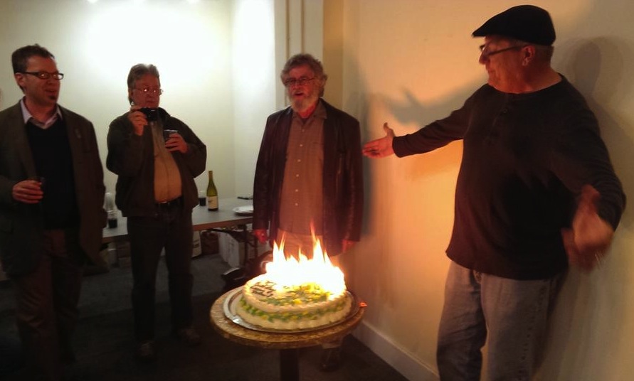 "Happy Birthday, Emperor Norton! Happy Birthday to you!" (l to r): Emperor's Bridge Campaign founder John Lumea; party guest; Joseph Amster, of Emperor Norton's Fantastic San Francisco Time Machine , in street clothes; and Gav Shelton, the Baker of the Cake (who also has a nice set of pipes!) 