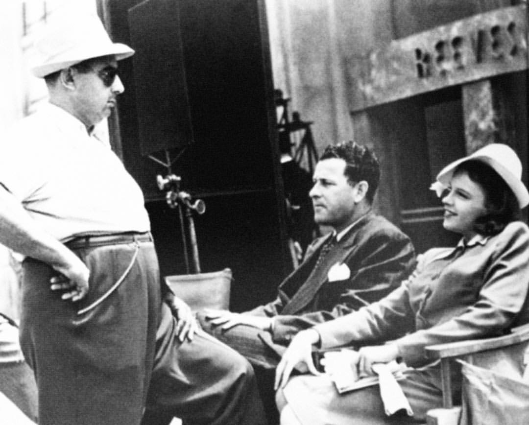 Roger Edens (center) with Judy Garland and director Norman Taurog on the set of Little Nellie Kelly , 1938. Source: fansofjoots .
