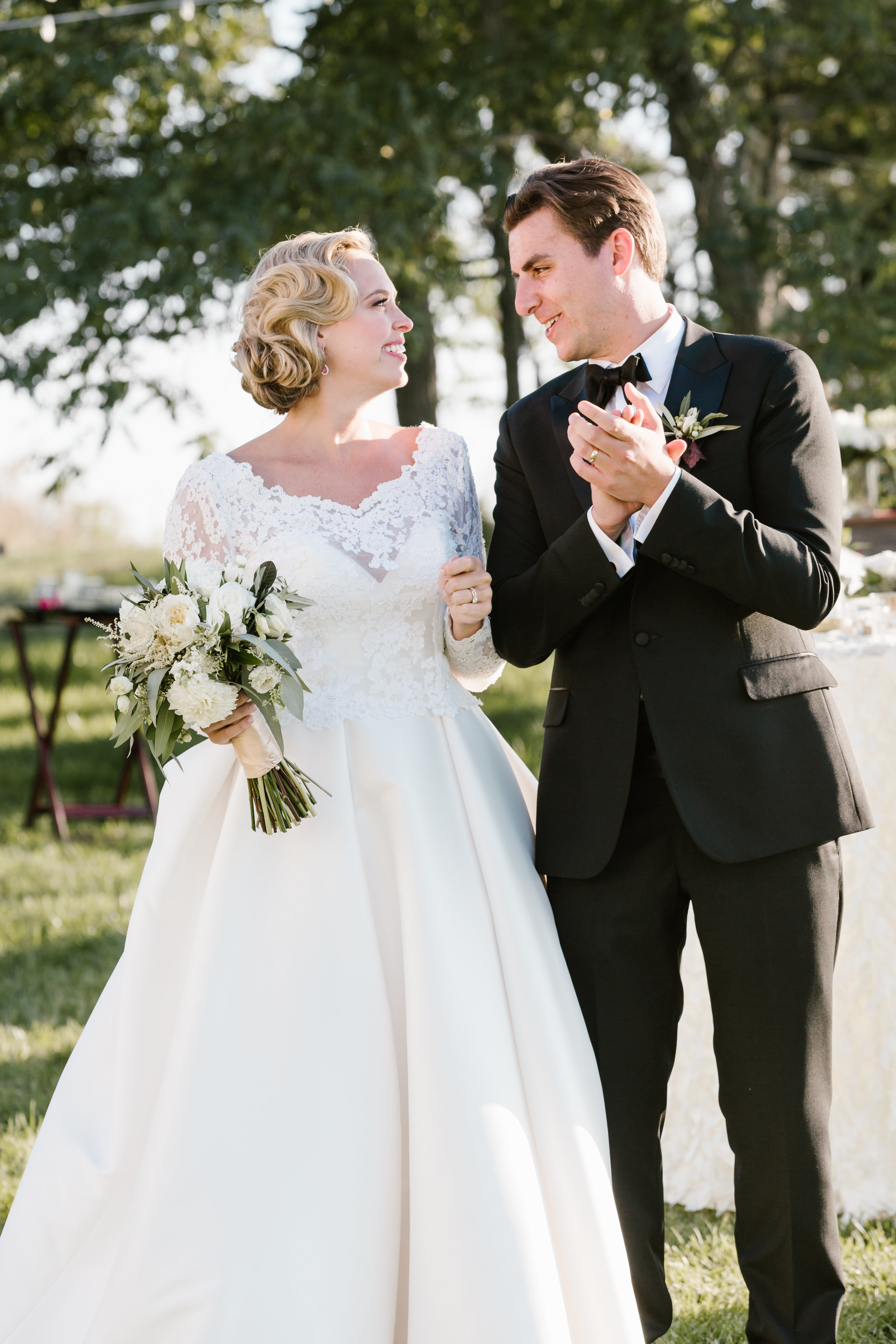 I can hang in the back while you get into position for the bridal party entrance. This was a shared moment between the bride and groom prior to them being announced by the DJ. Taken for Jennifer Mayo Studios.