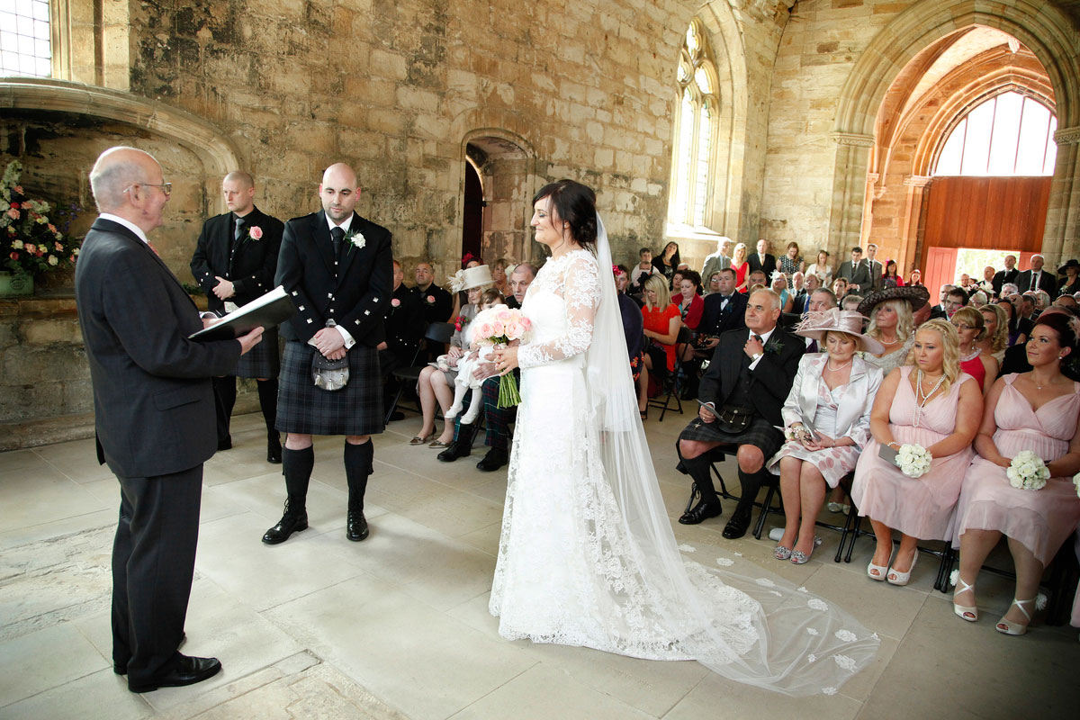 We applied some roses from the French lace onto the edge of Rhona's veil to compliment her dress