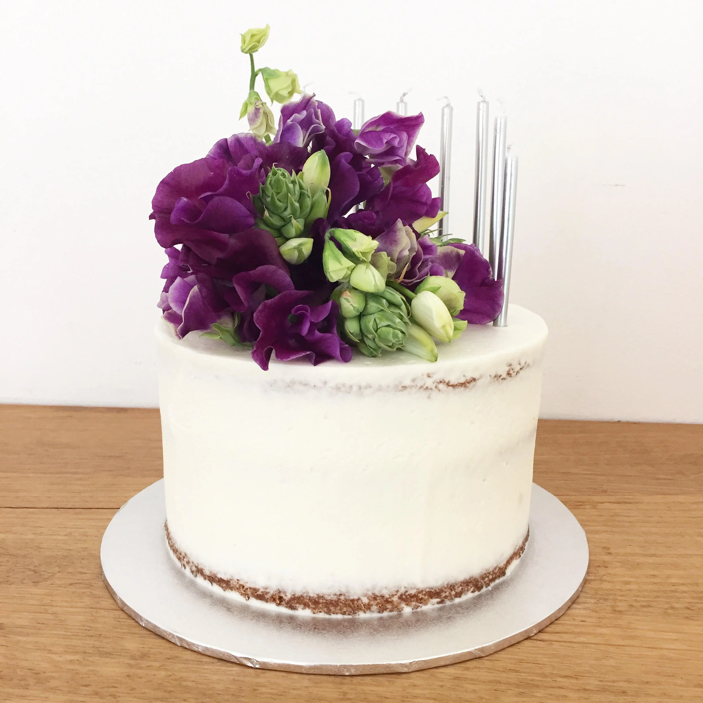 Semi Naked Cake with purple flowers.jpg