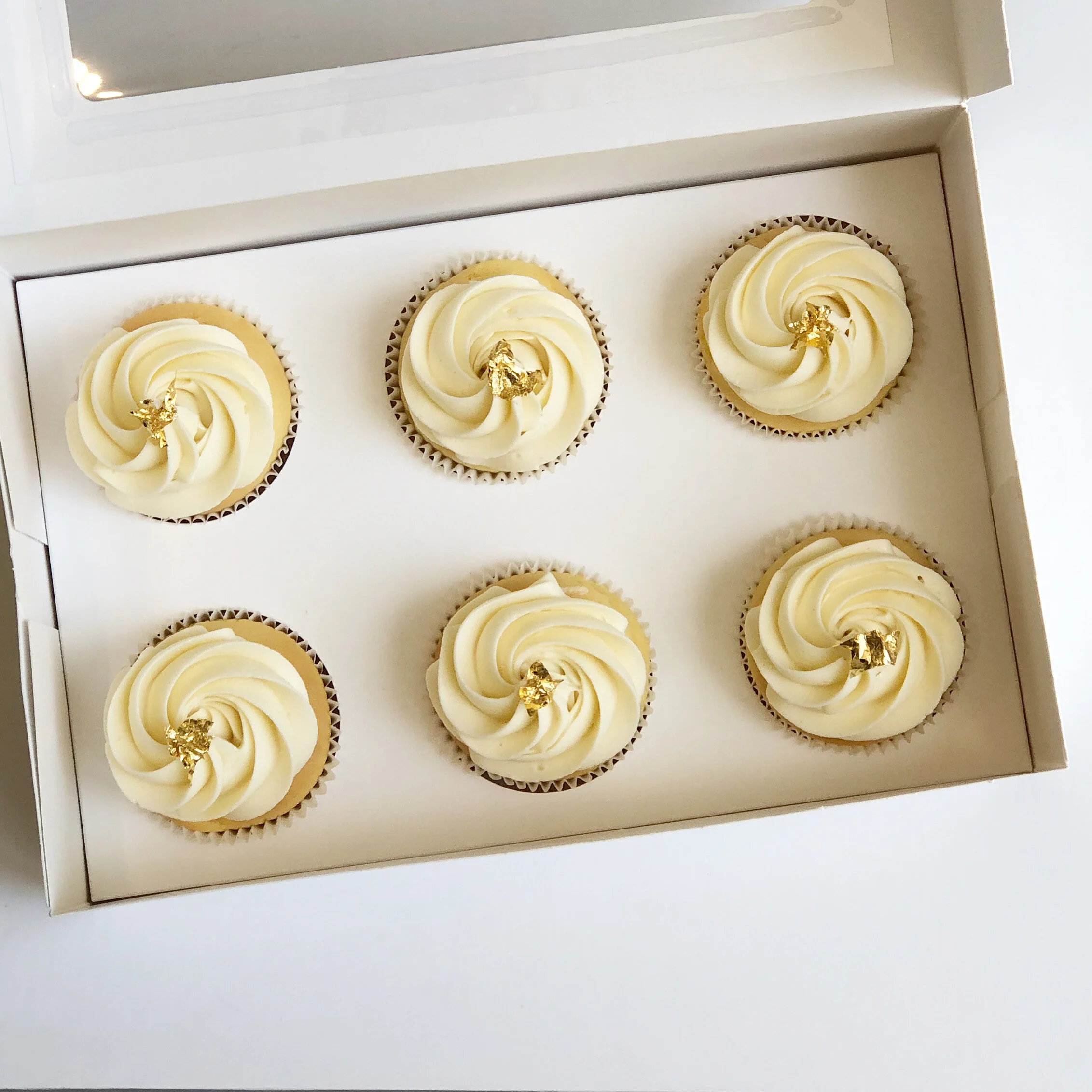 Butter Cream Swirl And Edible Gold Leaf Cupcakes