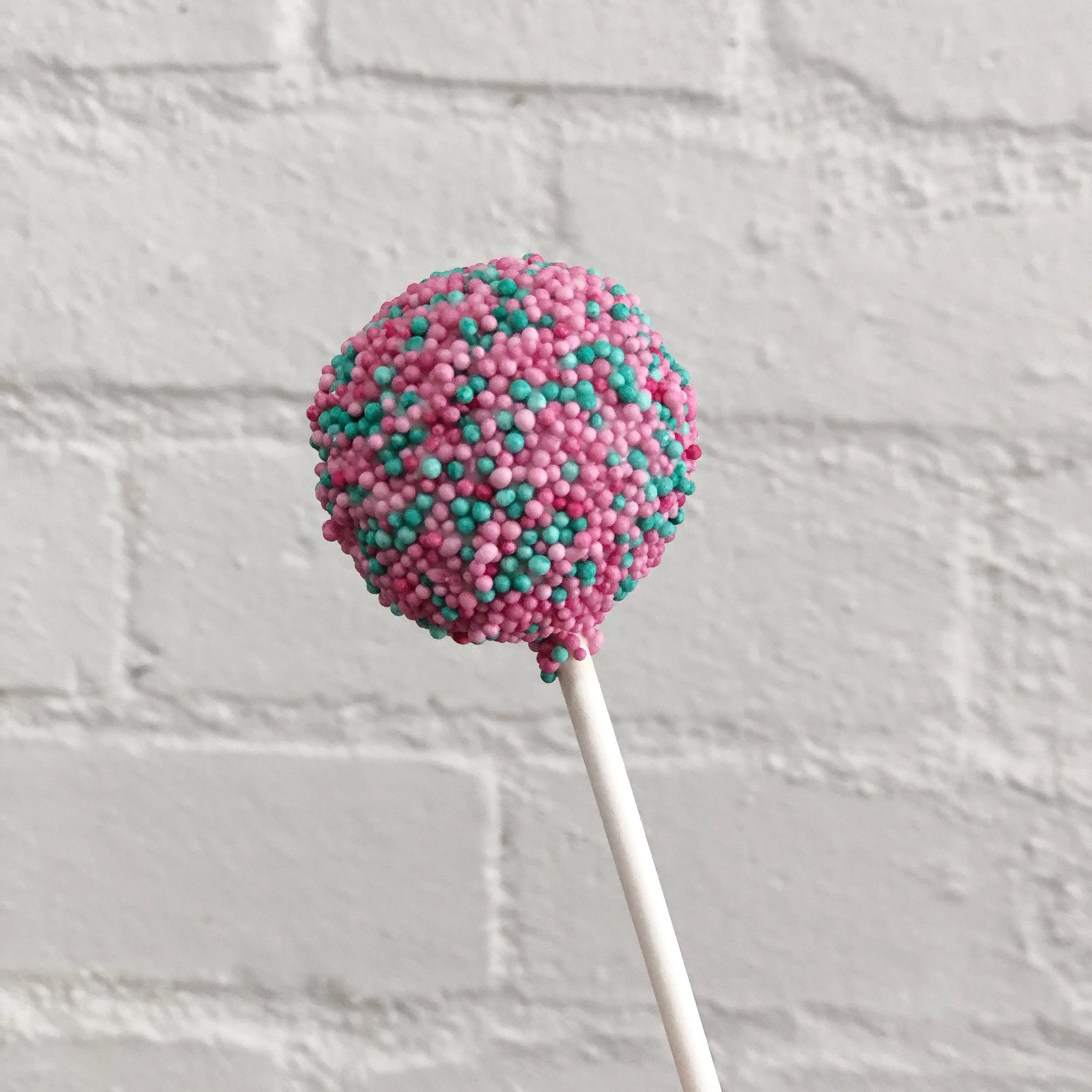 Pink-And-Green-100s-And-1000s-Cake-Pops.JPG