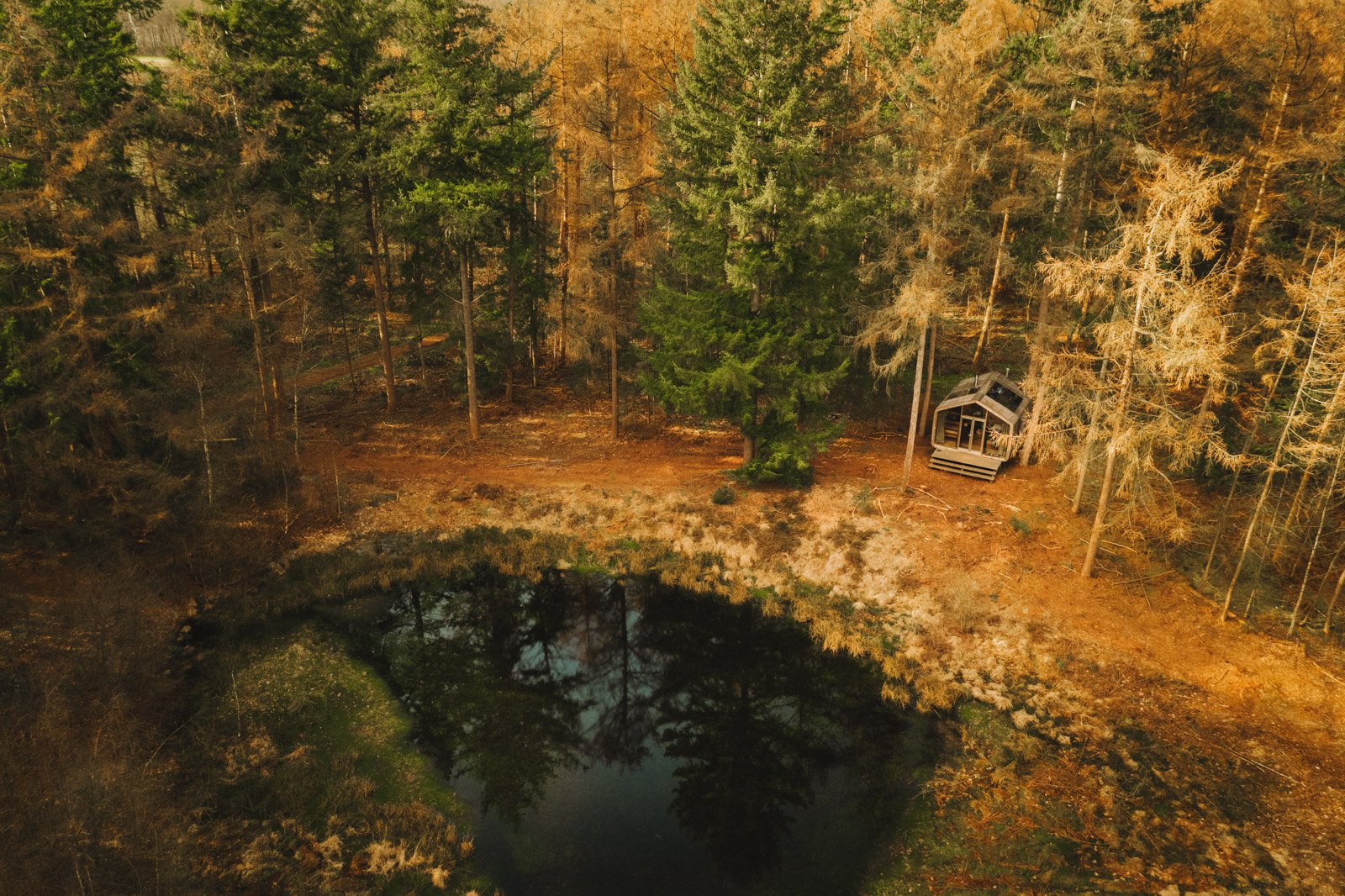 a rainwater collector and storage system to support an off-grid cabin experience