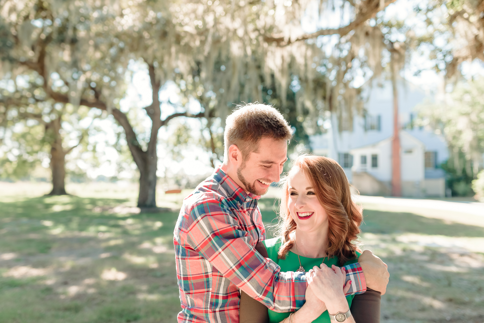 Natural, romantic engagement photos under live oaks and spanish moss, Charleston SC Engagement Photography