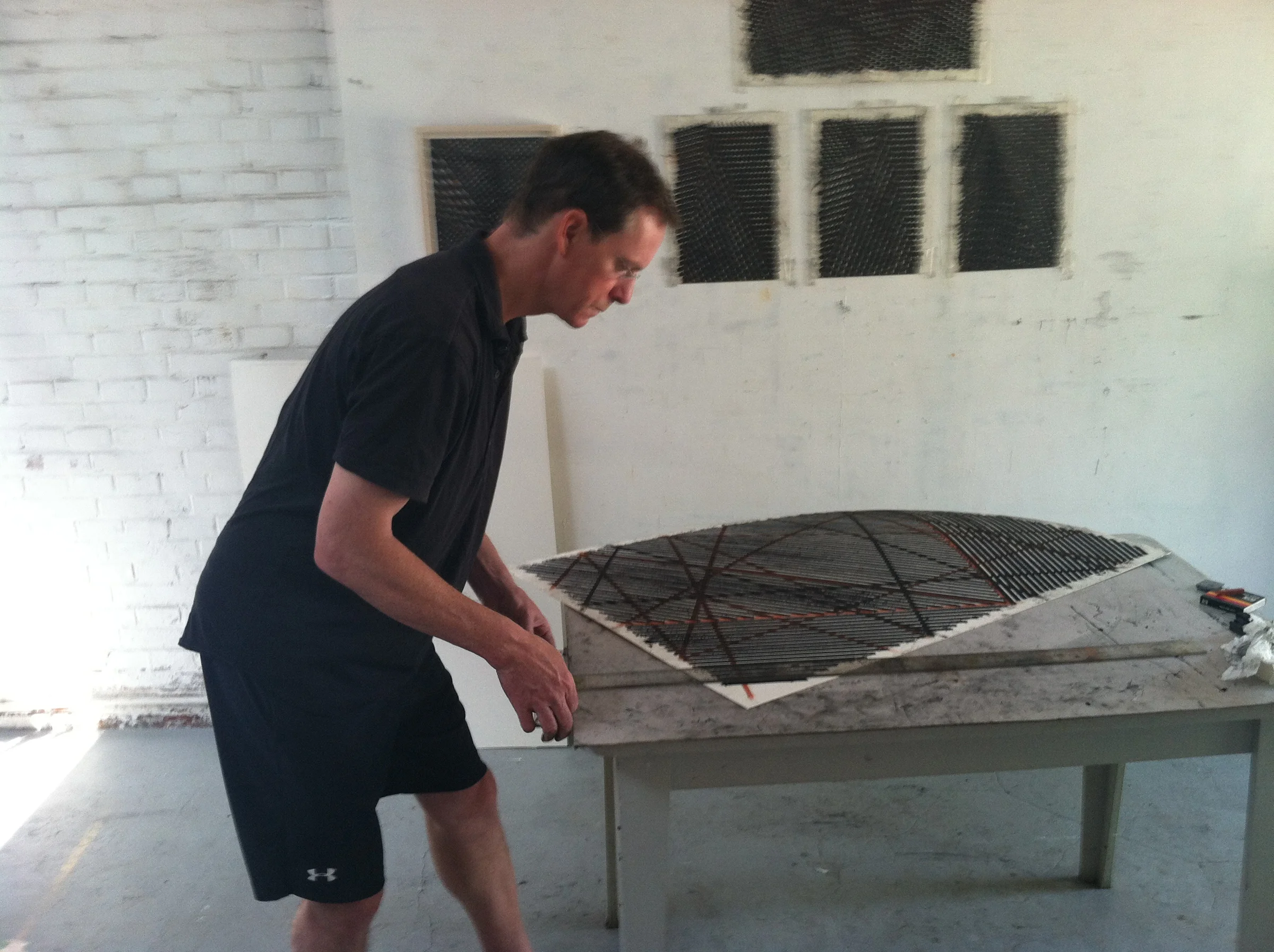 Stroud at work during at work on drawings that later served as the foundation for his "Open City" paintings at Red Gate's artist residency program in Beijing, China.