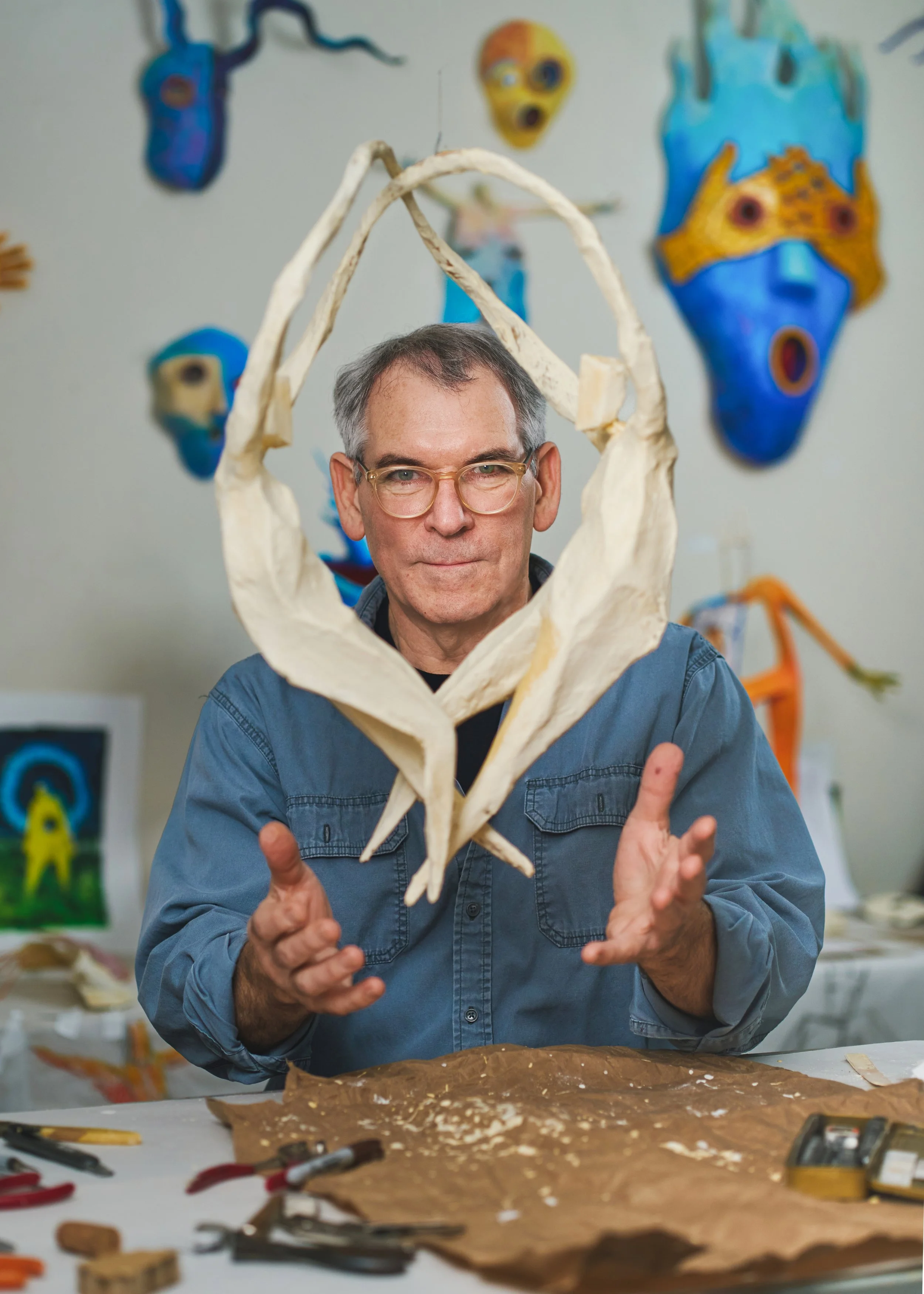 Suspended sculpture of two figures in an eternal dance