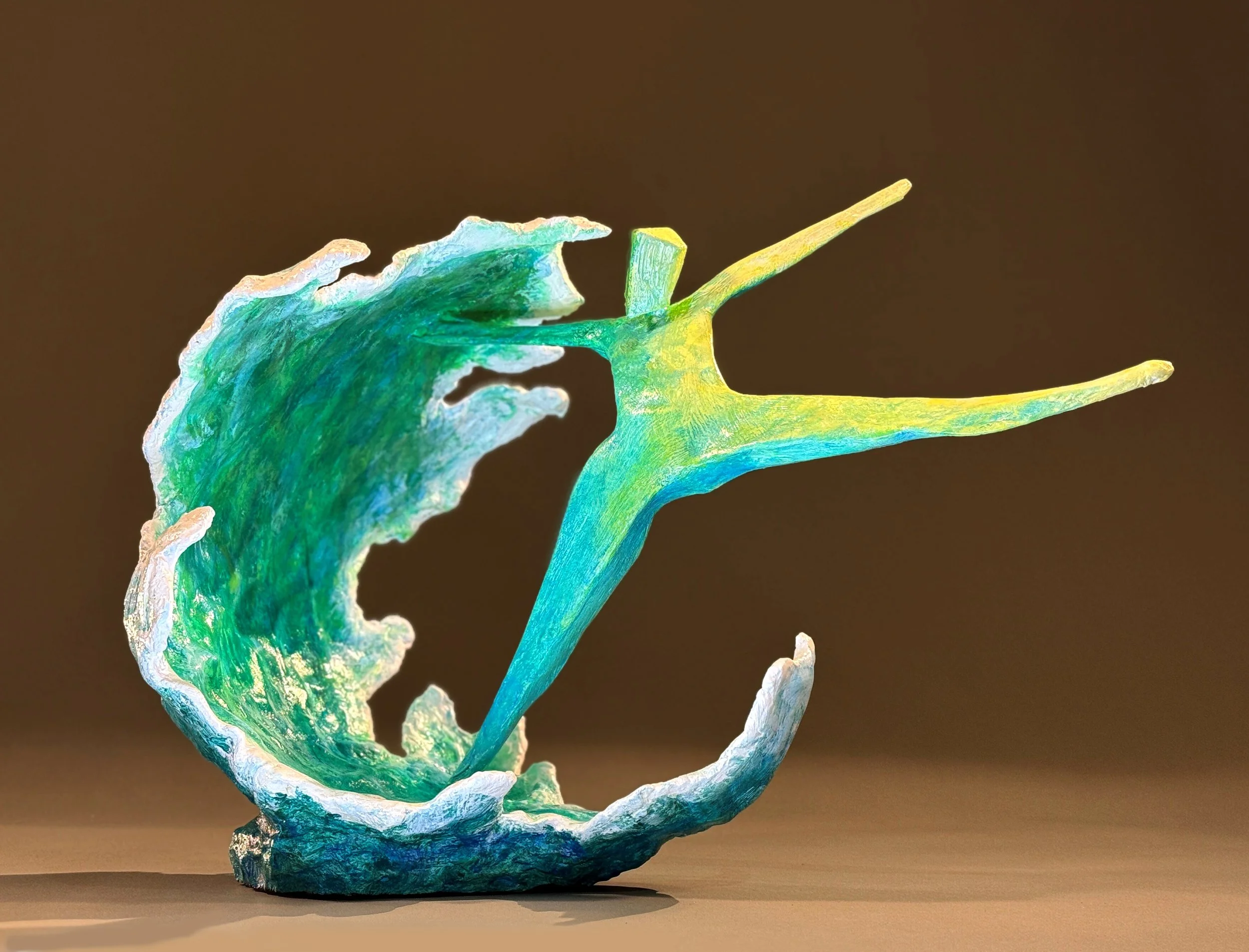 sculpture of figure dancing with a breaking wave