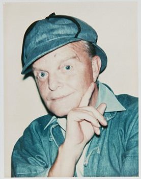 Older Truman dressed as Sherlock Holmes