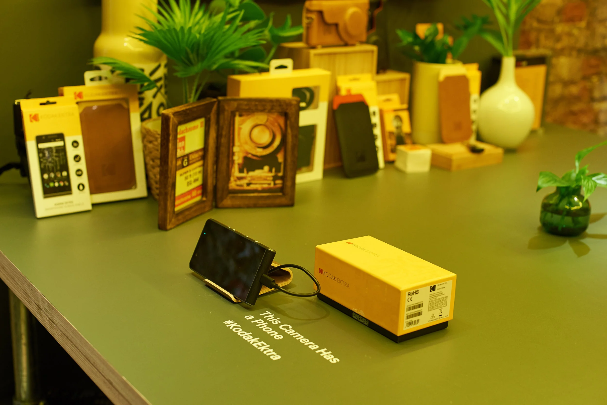 Film camera giants Kodak launched their latest smart phone just before christmas in 2016.
They had opened a pop up shop called Kodakery in London's Berwick Street in Soho, the pop up shop was a hit as it allowed people to come and try the phone's newest features such as being able to set the aperture, iso, shutter speed and even down to the White balance. The other features on the phone included being able to extend the phone memory and purchasing traditional prints. The pop up shop also allowed people to purchase branded clothing and kodak's tradition Portra 800 film.