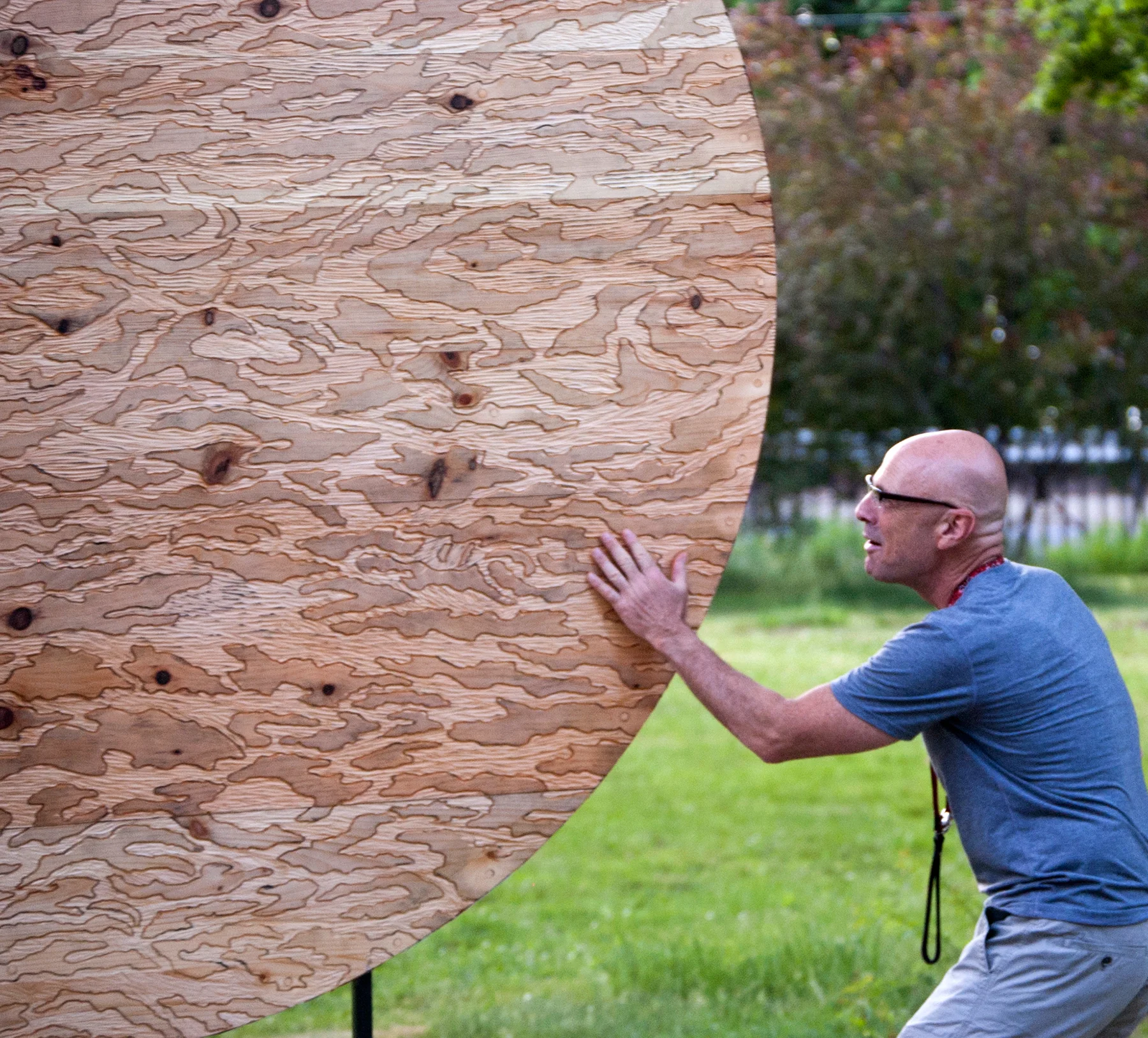 Ripple Effect - viewer Carved wood sculpture - pine and spruce, copper, steel and gravel - 7' diameter Installation at New House Center for Contemporary Art, FLUID 2015 Snug Harbor, Staten Island, NY May 2015- March 2016
