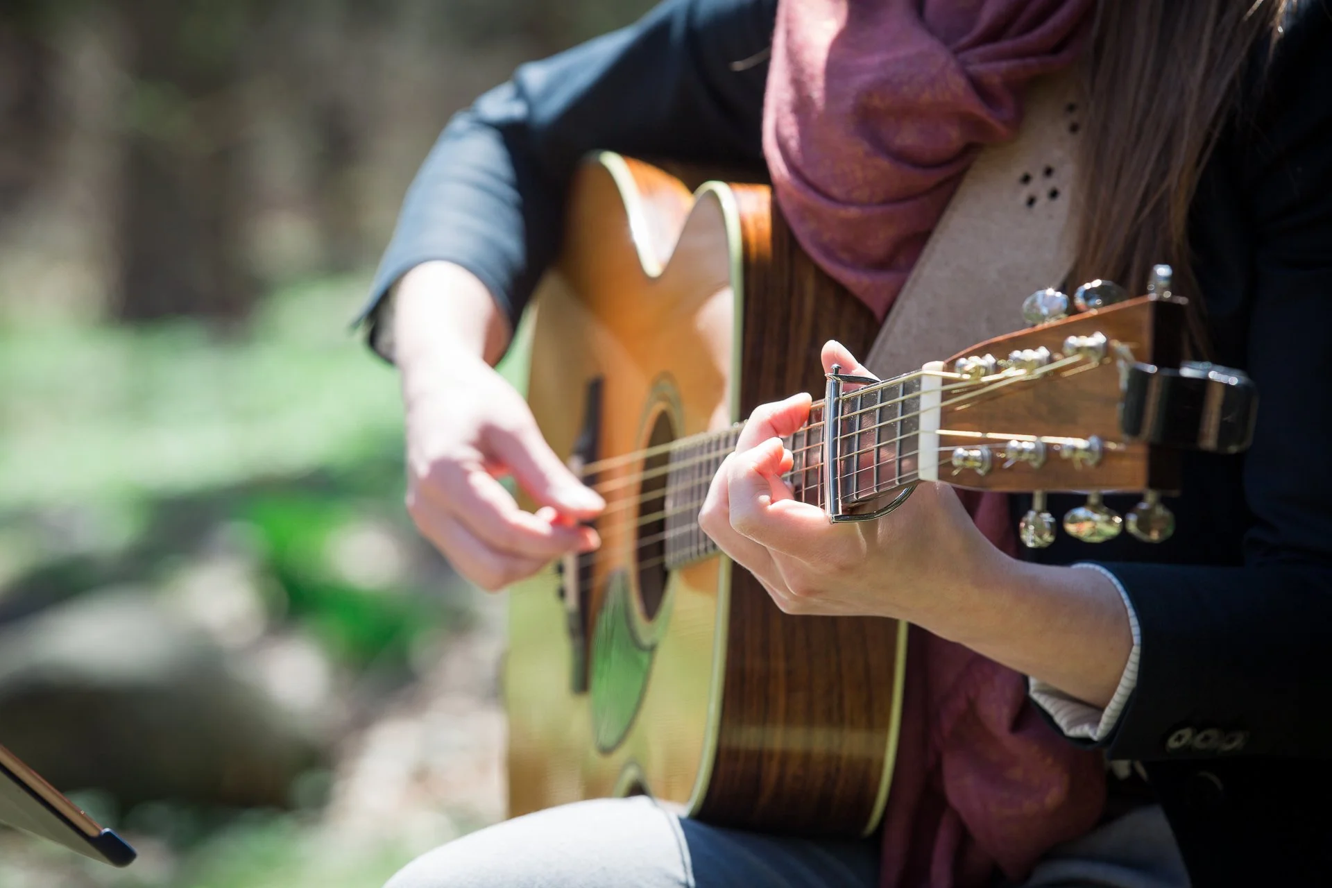 Guitar hands playing close up.jpg