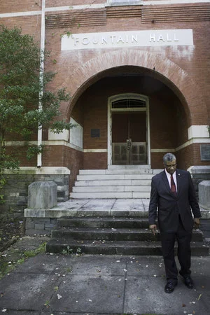 President Stanley Pritchett stands in front of the now boarded-up Fountain Hall, one of the oldest standing buildings on the Morris Brown Campus. Jarrett Christian for BuzzFeed News