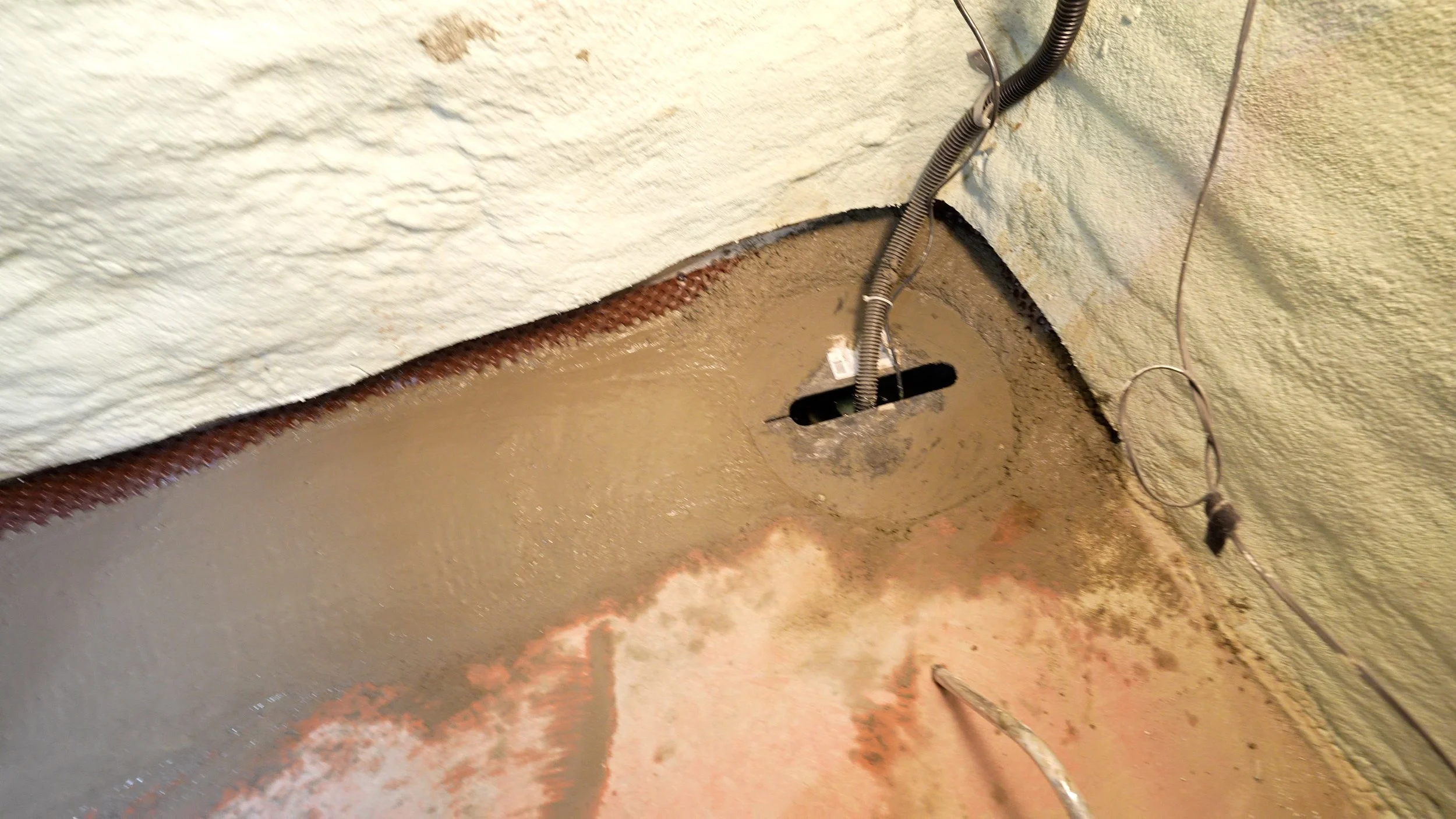 concrete around a sump pump pit