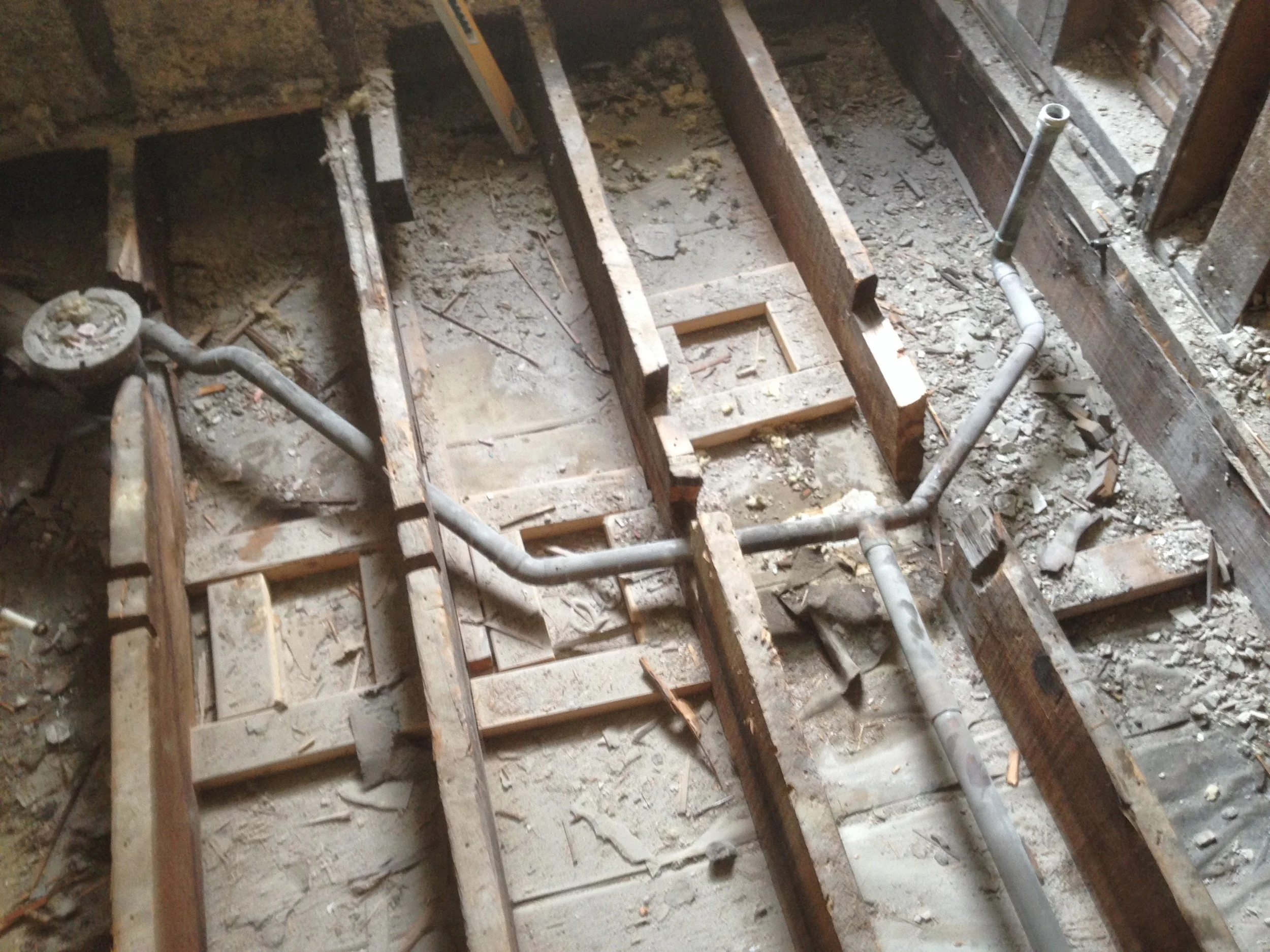 This is an extreme case.....but this was a plumbing job done years ago replacing the original plumbing from house. At close inspection you can see all the existing structure is compromised by the cutting of joists.
