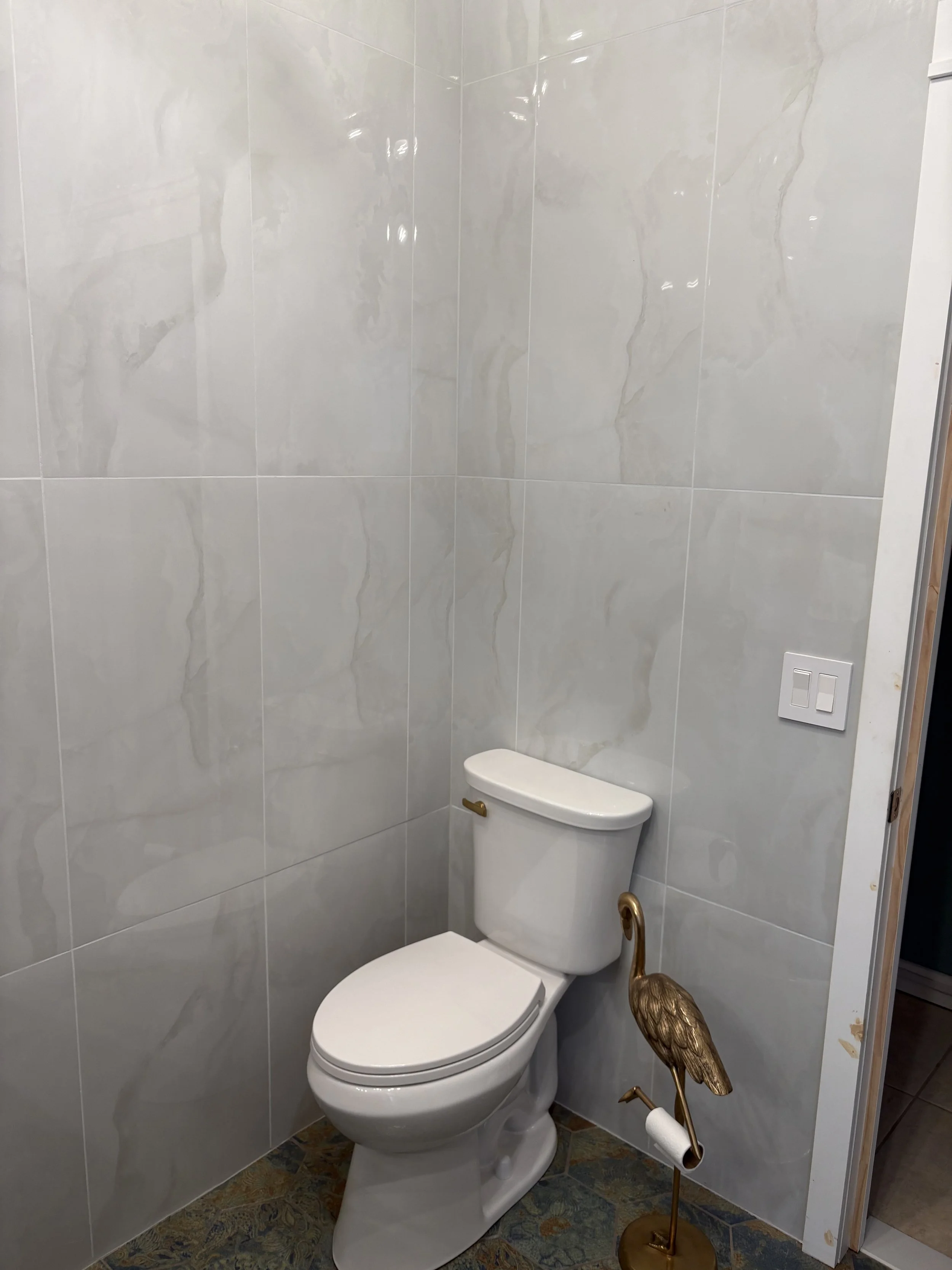 Wall tile behind a toilet.jpeg