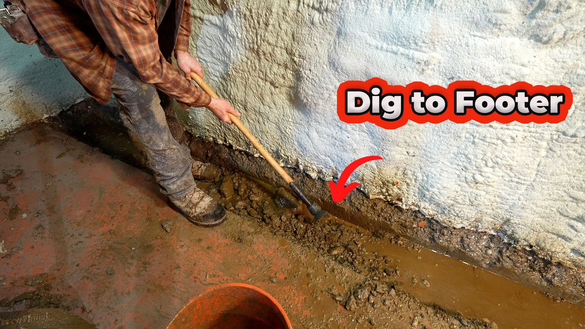 digging to bottom of footer for an interior French drain system
