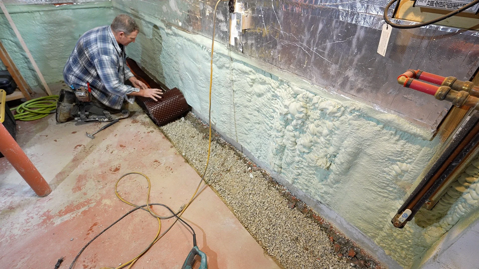 rolling out membrane for an interior French drain