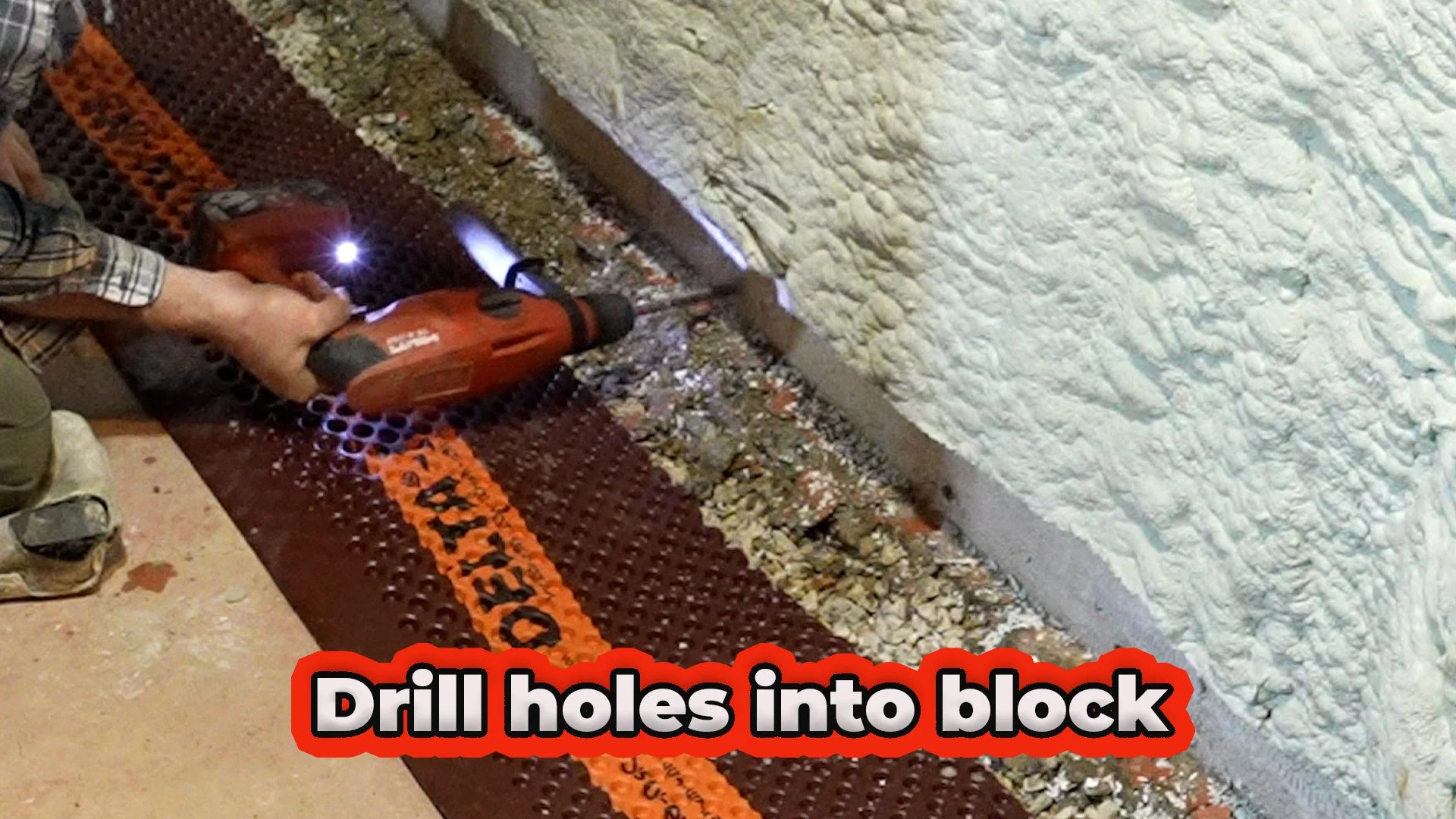 drill holes in foundation block before adding membrane for interior French drain
