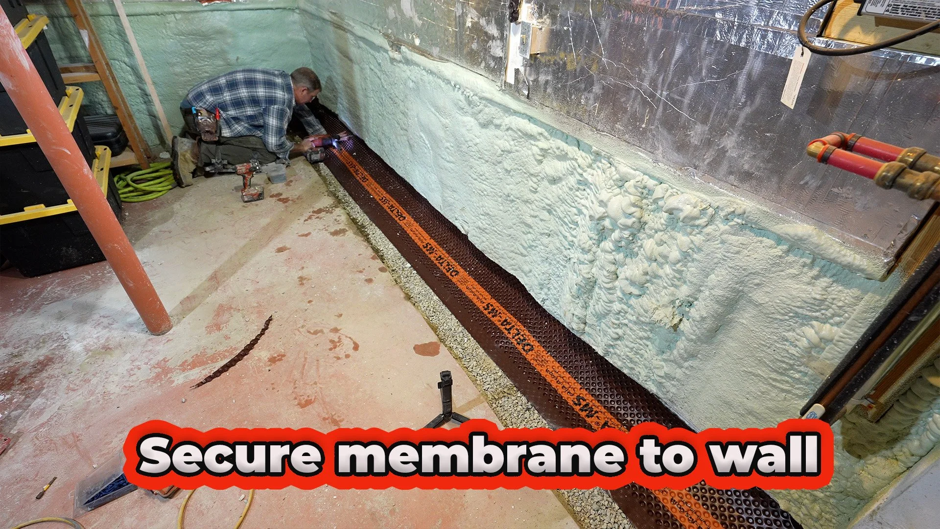 secure membrane to wall for interior French drain