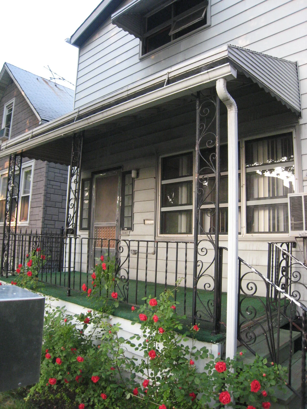 Not long after we moved in, summer 2009. That astro-turf porch was really something.