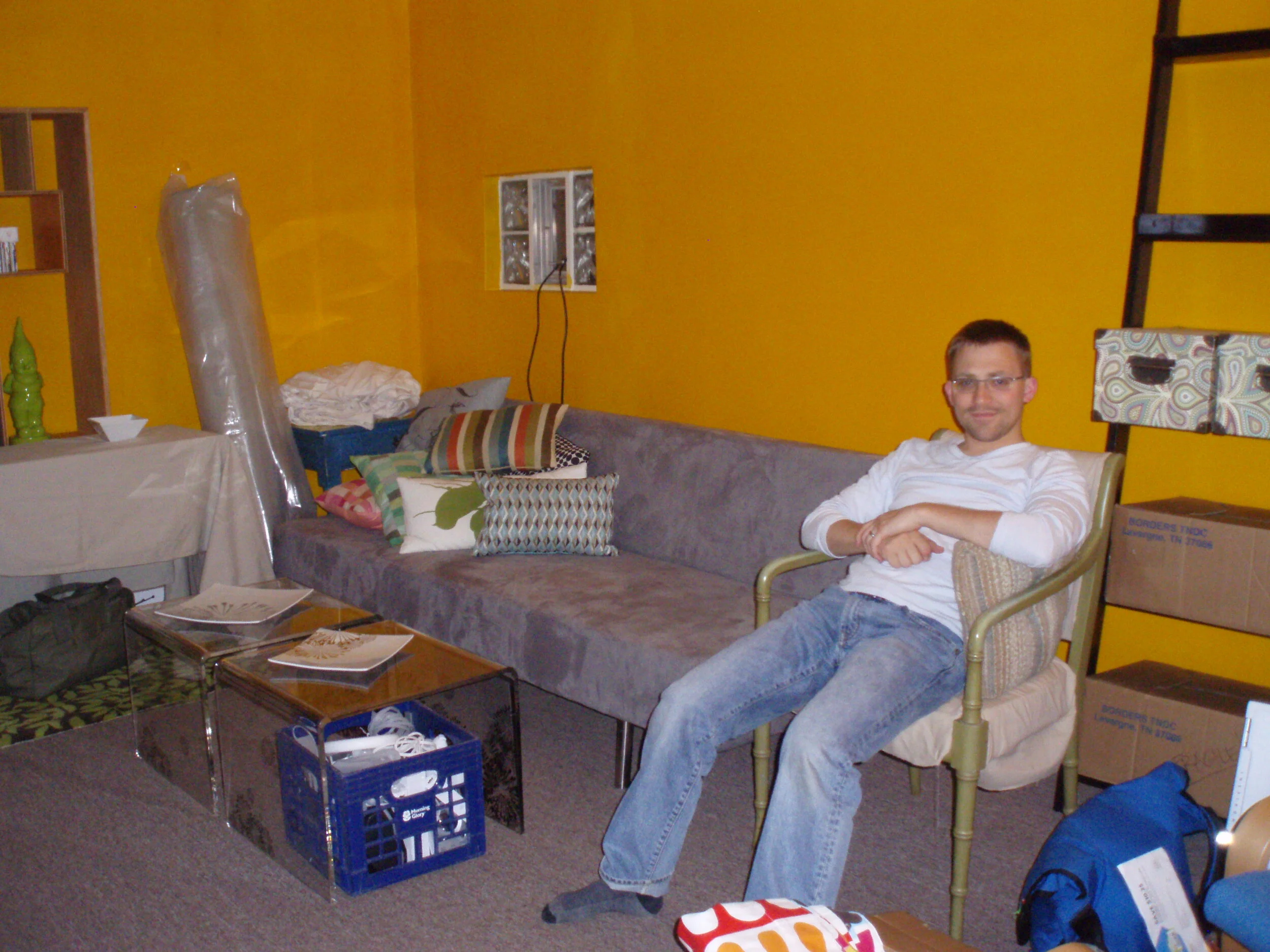The living room, circa move-in day. The paint color would go within weeks; the window would be replaced within months; but the carpet took a couple years to rip out and finish the hardwood underneath.
