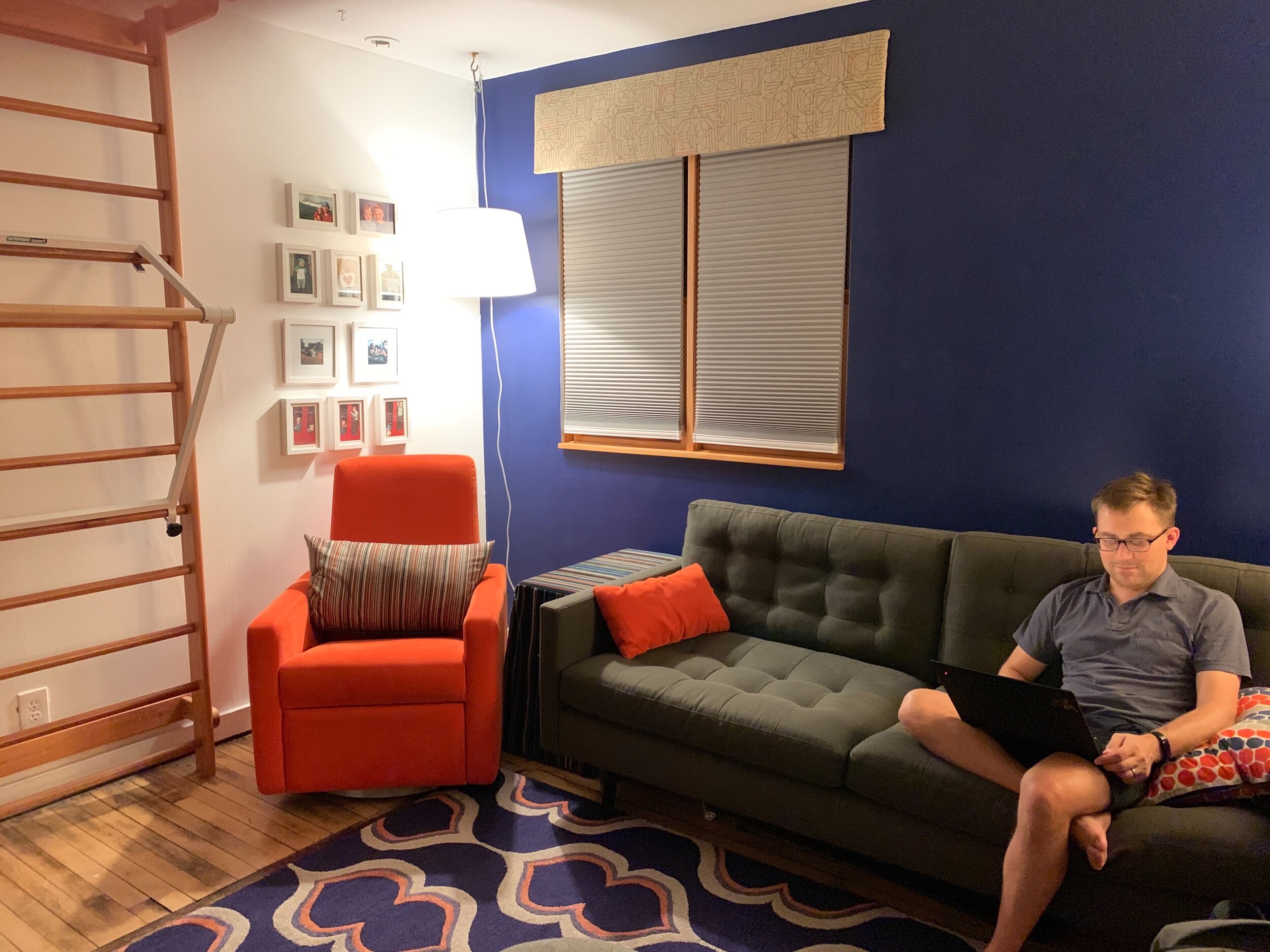 Same corner, ten years later (same cute dude). The ladder on the left is European gym equipment, for our sons to climb instead of the furniture.