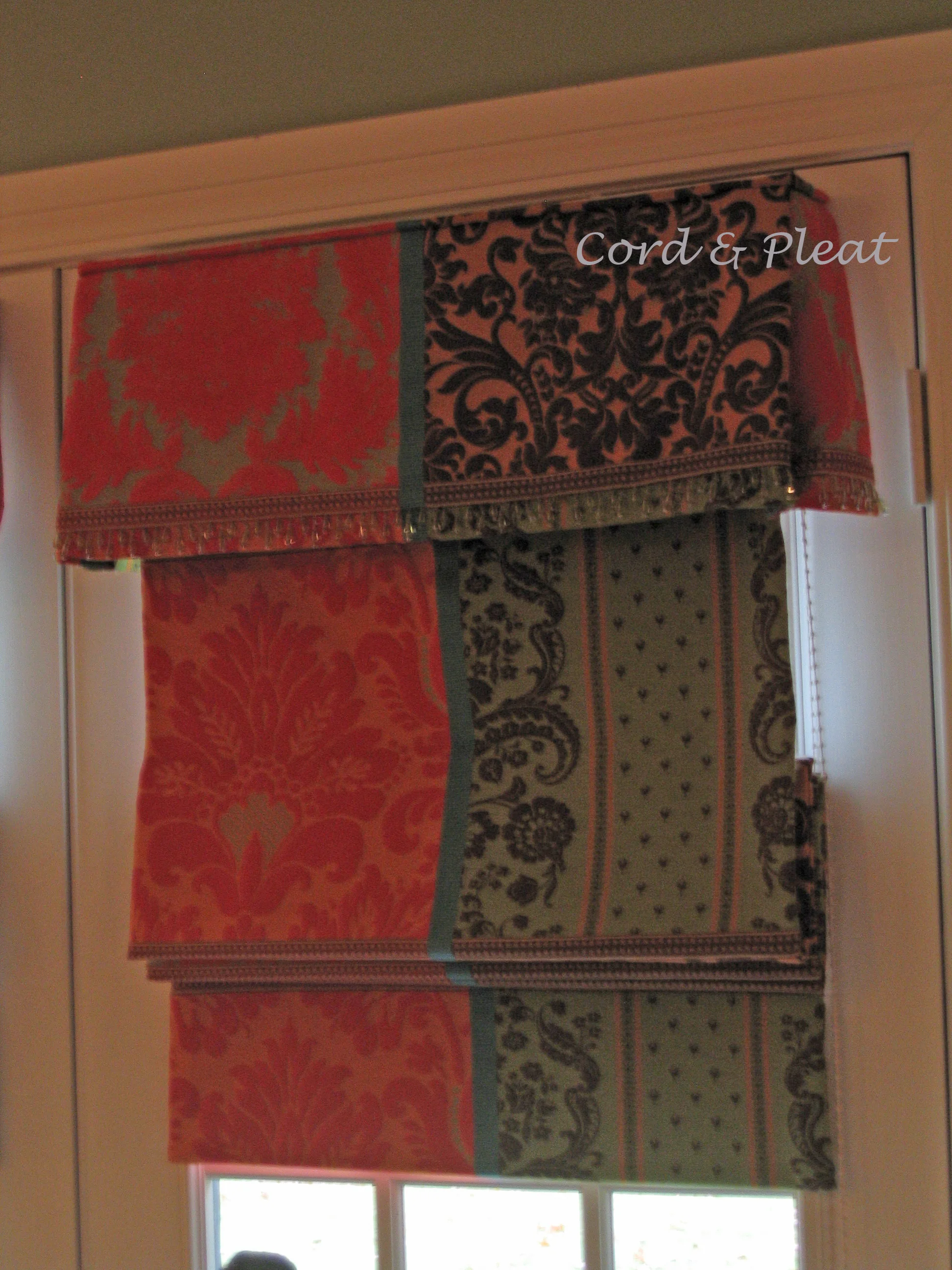 a Flat Roman shade w/Attached Valance; fabricated by Cord & Pleat Design, Inc.