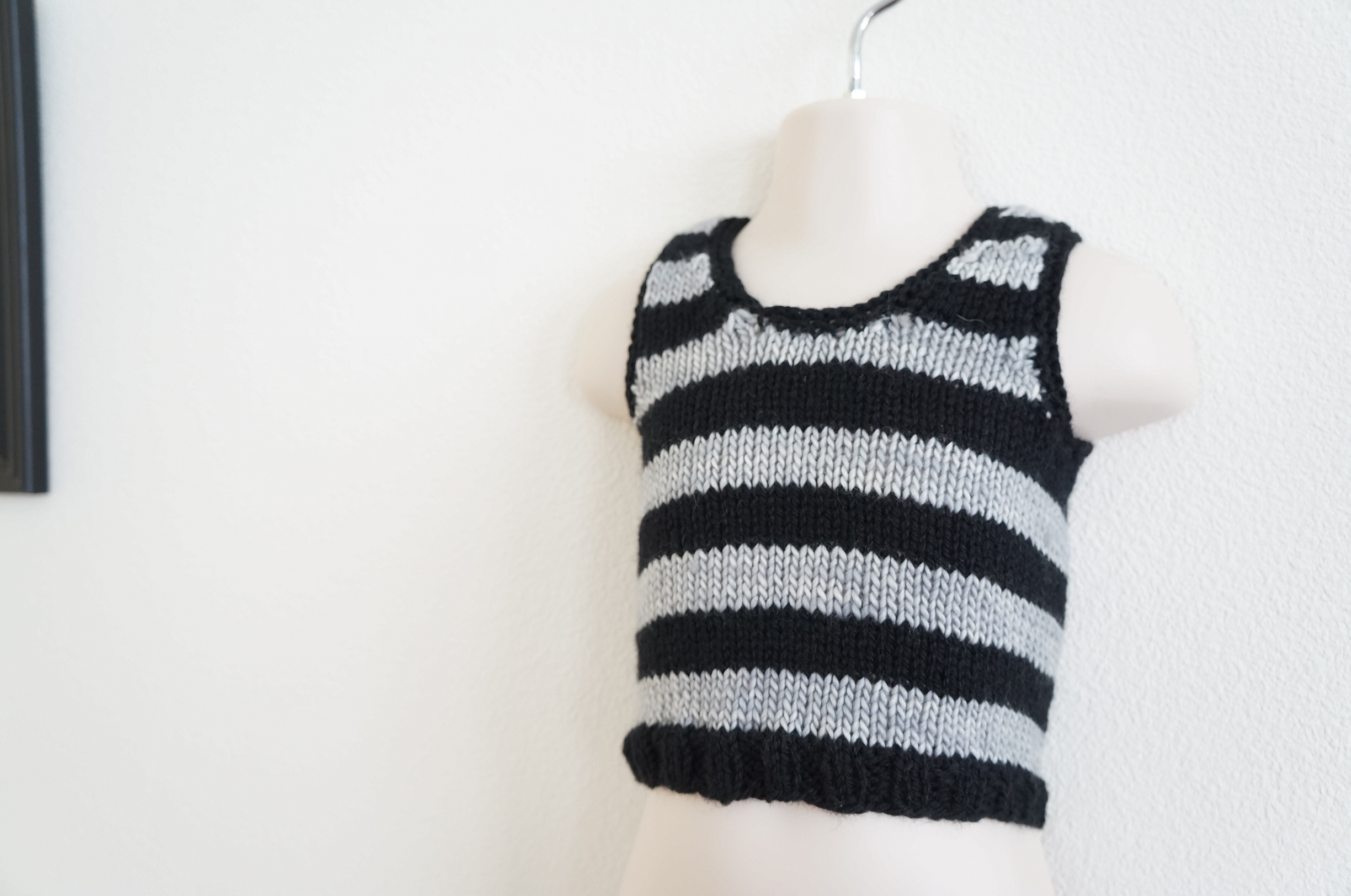 Dior-inspired vest is done in Paton's Classic Wool (Black) and Madelinetosh Tosh Merino (Silver Fox). | Handmade Fashion at Candy + Bagel