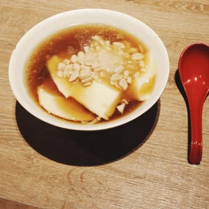 Dou Hua: Tofu Pudding with Peanuts and Ginger Syrup