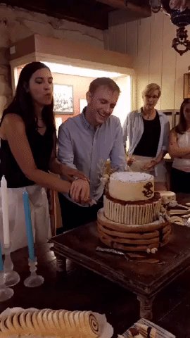 Sam-Zephyr-cake-cutting.gif