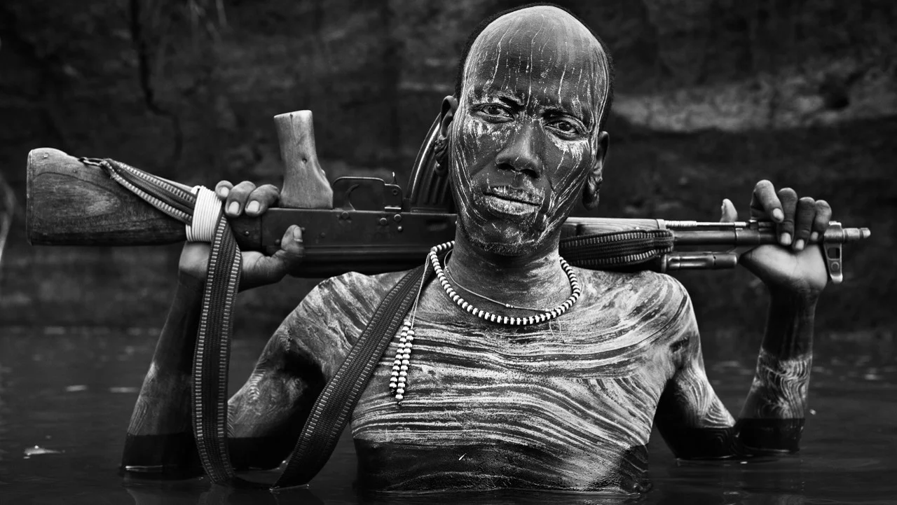David Yarrow - Warrior Portrait, The Omo, Ethiopia, 2013.