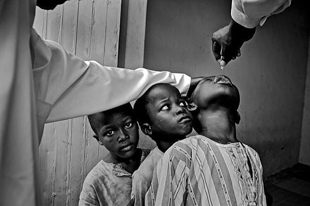 Nigeria's Polio Nightmare: Kano, Nigeria Boys wait their turn for two drops of polio vaccine. Taken by Mary F. Calvert, published by The Washington Times. She is currently a freelance photographer and we recommend you check out her incredible project