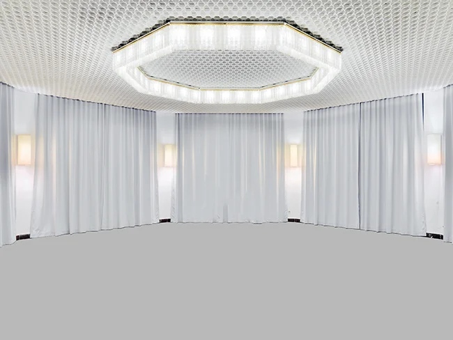 Untitled 1, 2013, Inkjet print mounted on MDF, 100 x 150 cm Sukan’s new photographic work explores the conventions of the modern white cube as both an architectural context and as a content subject in and of itself. By addressing the notions of spatial memory, presentation and representation, this exhibition enhances the confrontation between visibility and invisibility in social and phenomenological terms. Arslan Sukan appropriates images from the internet of ‘installation shots’, white cube spaces within museums, galleries and art institutions around the world. His first step is returning them to their original state by digitally removing the artworks inside. He then manipulates the remaining image, 'the original condition of the gallery', by digitally painting some of the parts, like walls, ceilings or floors. Sukan's layered approach embraces the disputed characteristics of the white cube and 'as a sacred space undisturbed by time'; at the same time it expands the potential of artistic intervention in a gallery by transforming the space itself on a plane surface. The artist’s reconceived images of uninterrupted spaces, composed of heightened geometrical shapes, touch base with the minimalist aesthetic and its emphasis on the viewer’s perception, while the flatness of the picture calls to mind the infinite possibilities in abstract paintings. By means of deconstruction, intervention and reconstruction of the white cube, Sukan brings complicity between opposites and creates dualism between recognition and non-recognition, visibility and invisibility, abstraction and concrete concepts. The result is an entirely new space, an architecture of past and future, with a continuously shifting viewpoint. Sukan proposes a phenomenal situation, challenging the viewer on the realism of the photograph and the memory of a space, while also opening up the horizons of the viewer’s perception and interpretation of the exhibition's/ their own immediate setting.