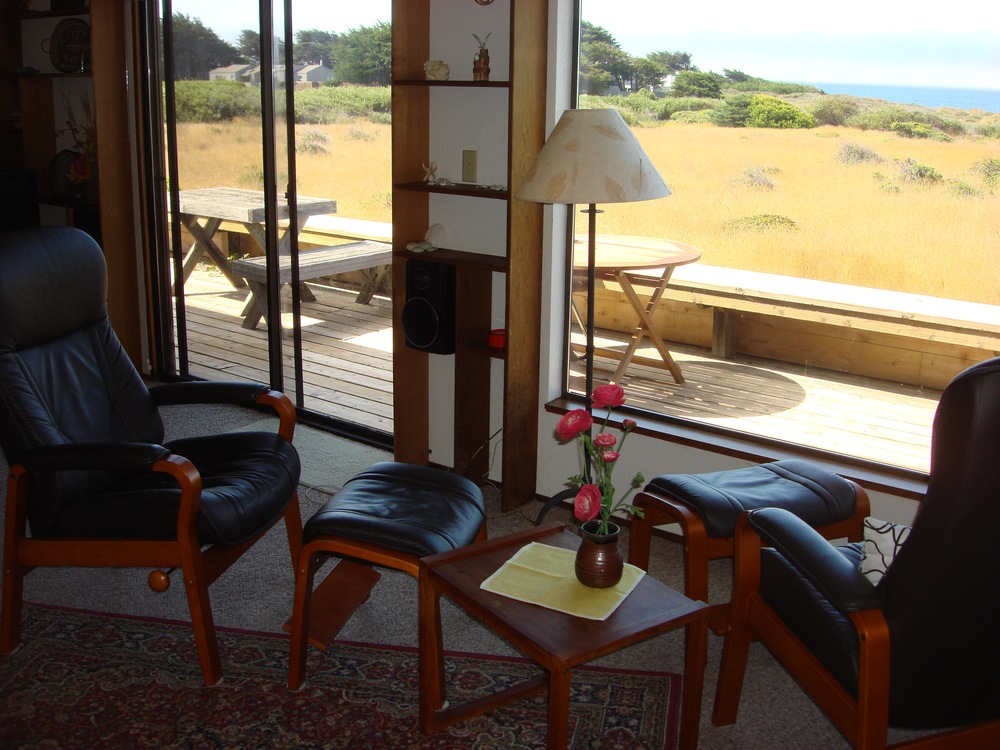 Watch the waves crashing into the cove, or the deer grazing in the ocean meadow, or the clouds rolling in, from the comfort of ergonomically perfectly designed Scandinavian leather chairs .....