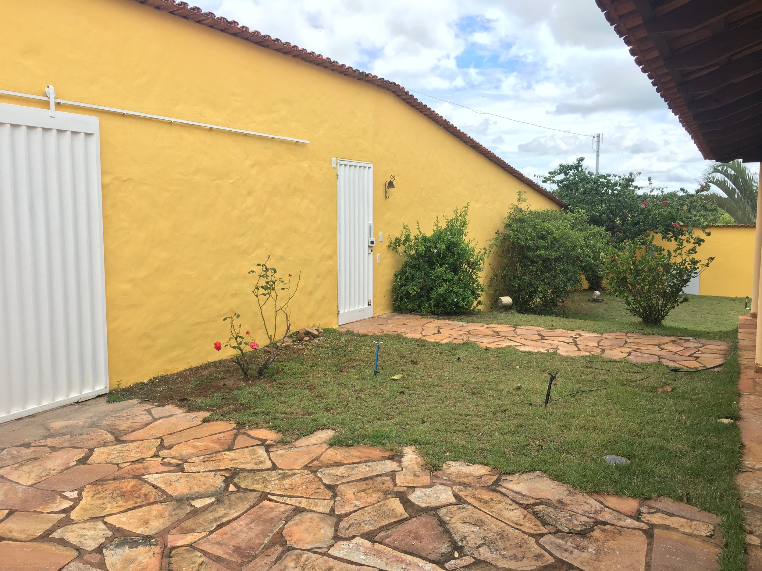 Casa de Luz - pedestrian entry (right) and garage door entry into walled property