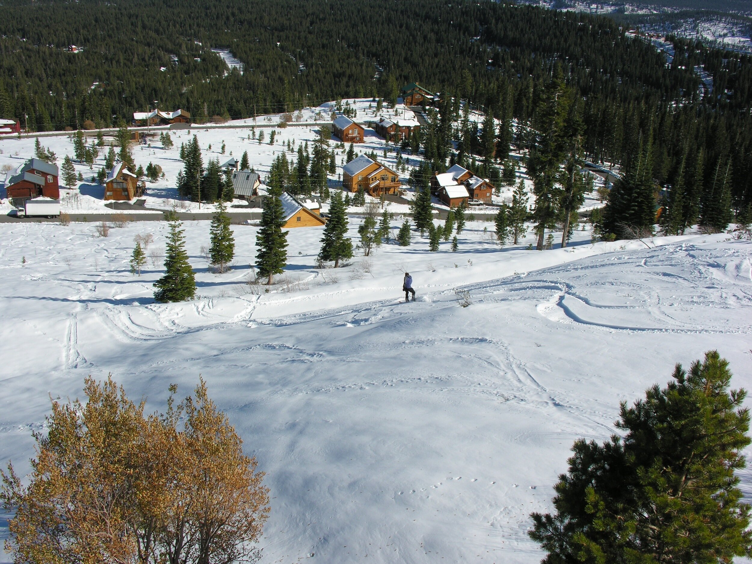 ... snowboarding down the hill in front of Alta Vista Chalet at Tahoe-Donner ... 