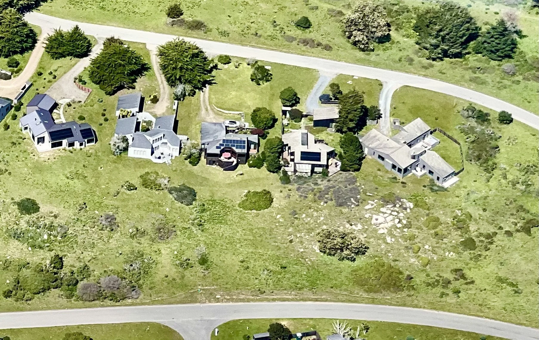 Bella Vista, in center with red umbrella; located 60 ft. above Leeward Road in foreground. (photo J. Heinemann, 4/13/2025)