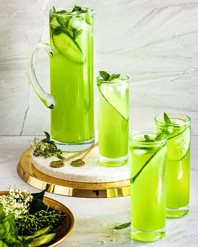 Day 8 of my christmas countdown is a bit healthier with this bright green Cucumber Elderflower Spritzer. The colour is fabulous and could almost be Kermit the Frog inspired!

It’s very refreshing on a hot summer’s day, and you can make it non alcoholic by replacing the wine with soda or tonic. 
Enjoy! 
Recipe on the blog at - link in profile