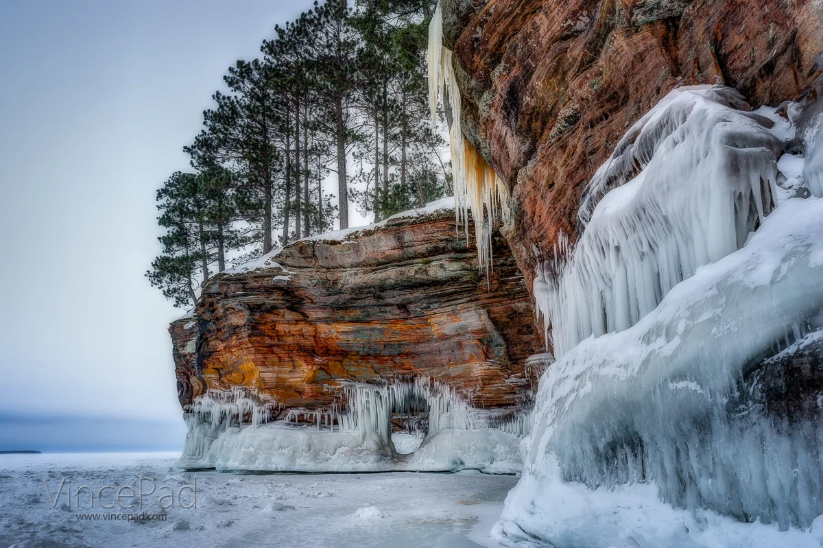 A cave eroded out from the middle of a peninsula jutting out into Lake Superior