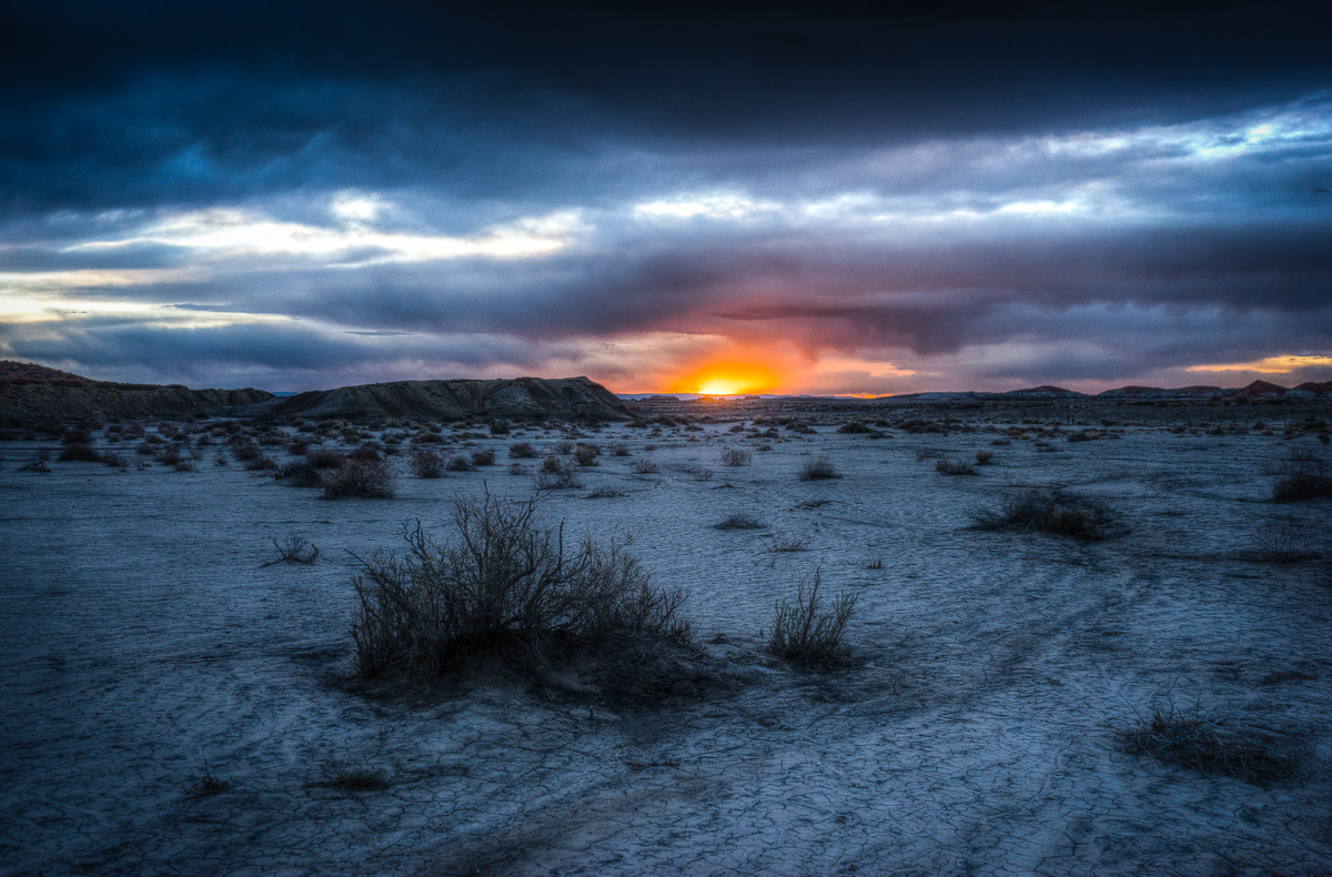 I had already packed up for the day - it was getting quite dark because of the clouds, and the sun seemed to be losing its battle to peek through, when this happened just as the sun's last sliver peeked out above the horizon.