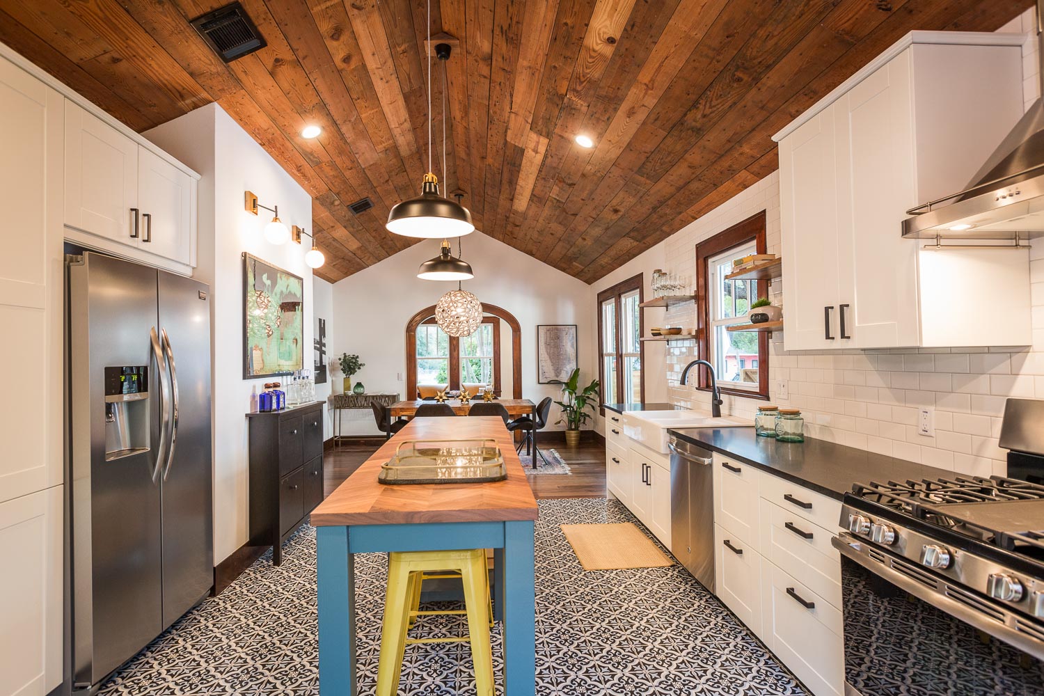 Another view of the kitchen towards the open dining room. Notice the vault and shiplap continues. 