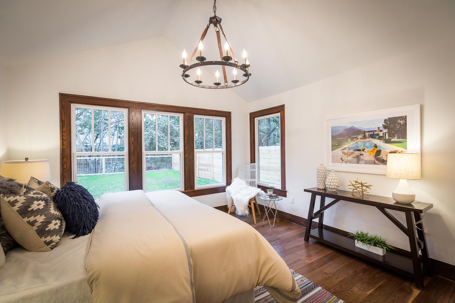 Another view of the master bedroom. Elite Austin Staging provided the perfect staging for the exceptional room. Notice the window bank with dark wood trim.