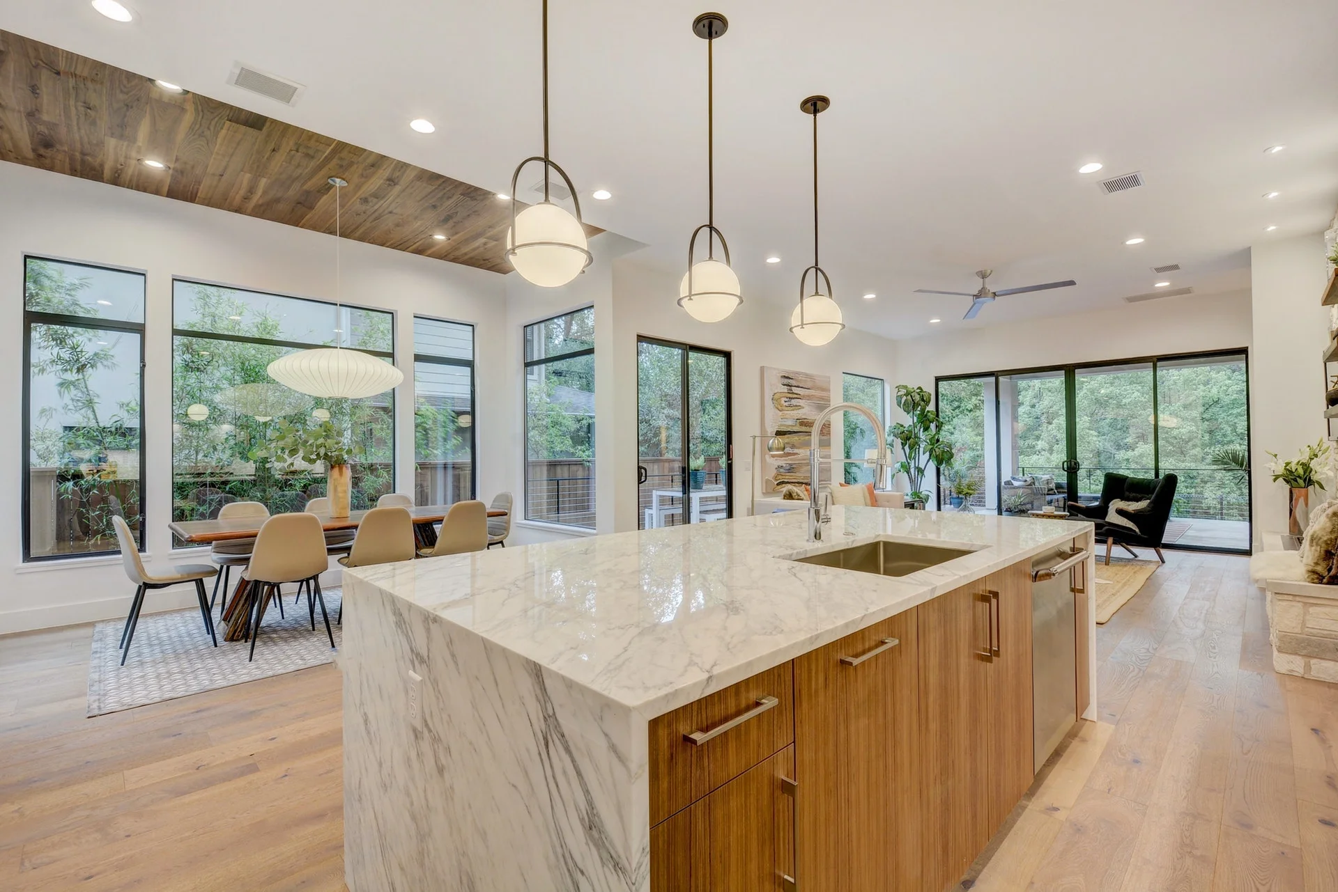 Premium custom kitchen looking into great room and dining room in Bouldin new home Austin Texas 78704