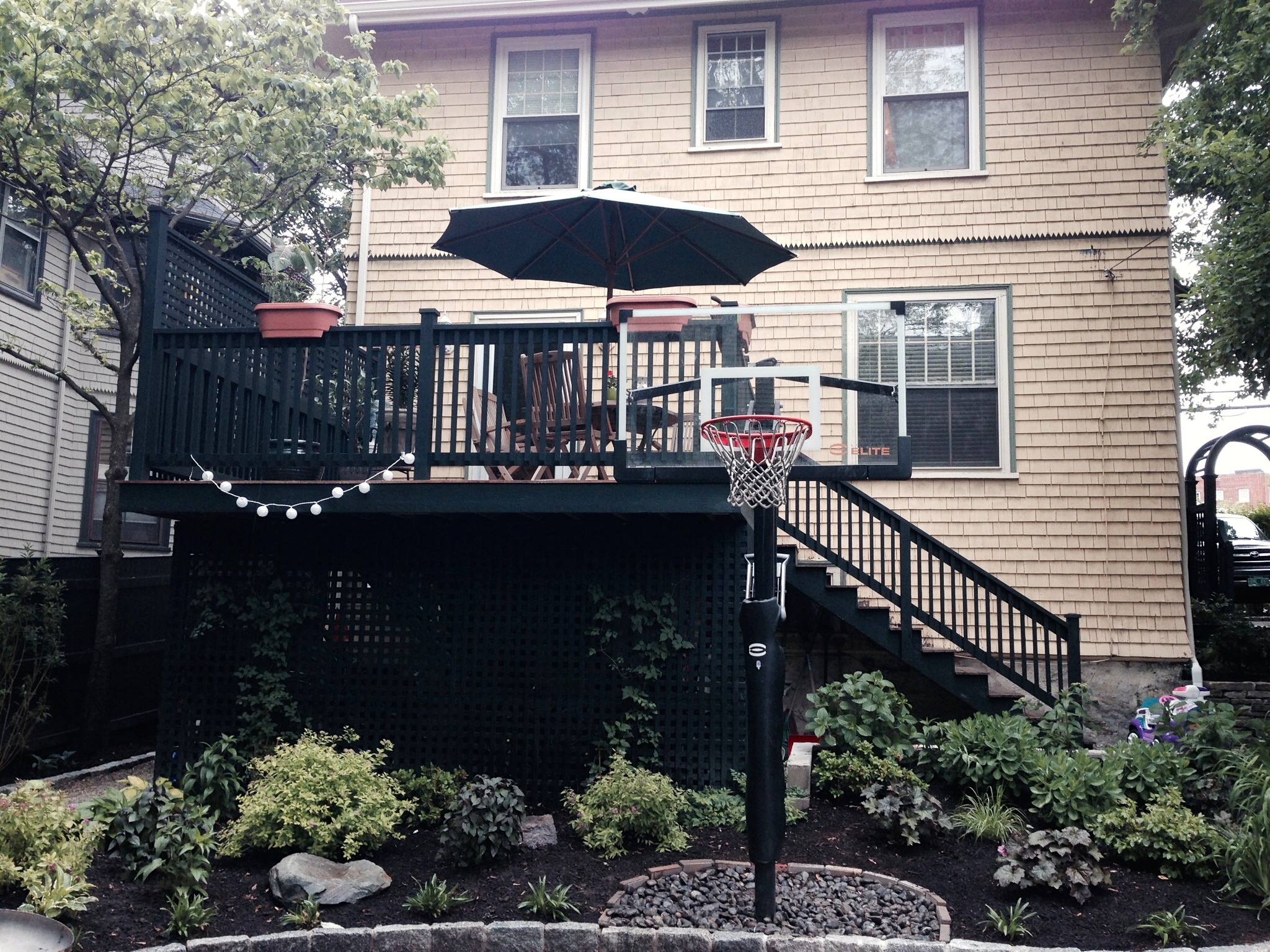 We rebuilt the deck, added privacy lattice and painted it the same color as the fence to tie it all together.