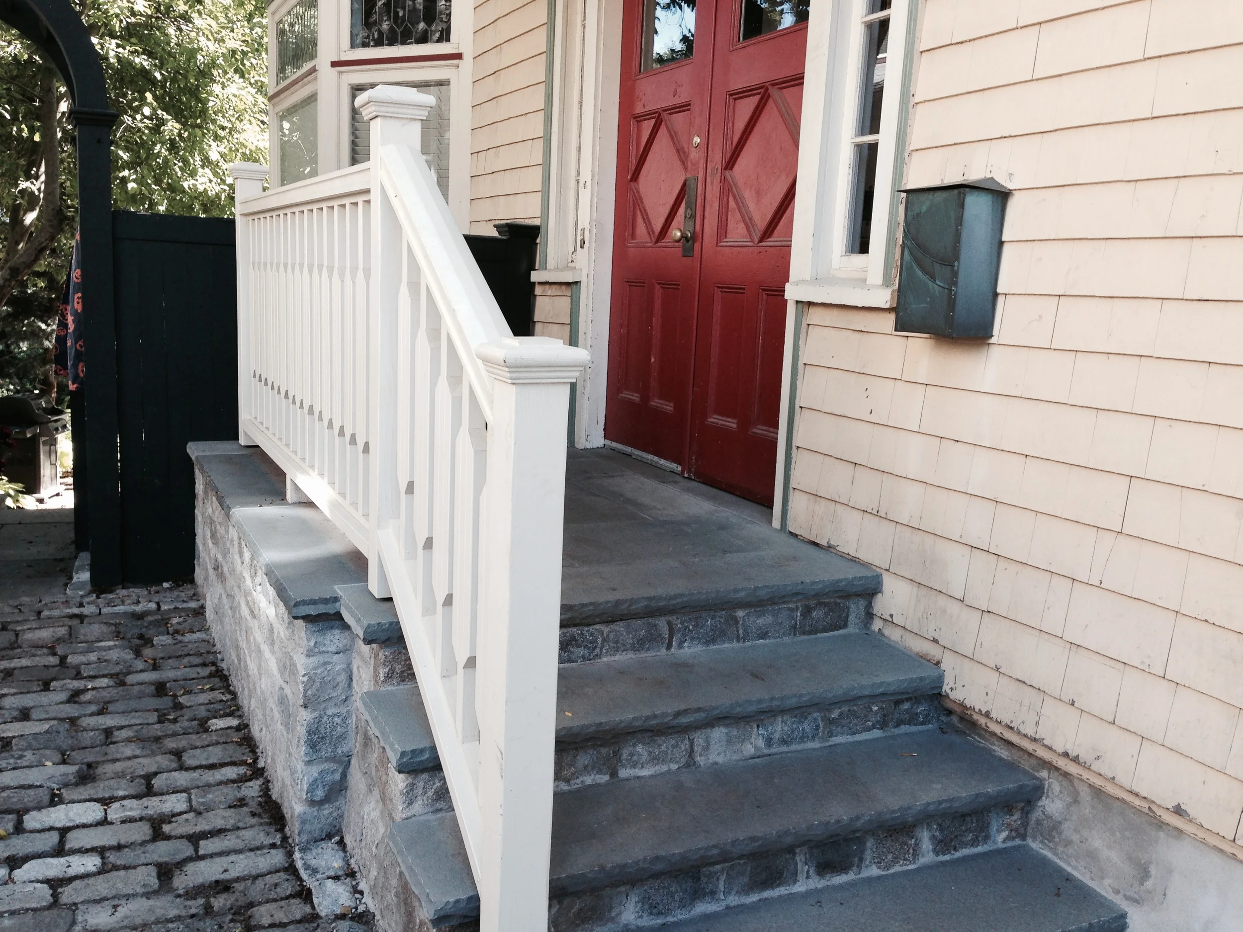 e custom designed and built a railing inspired by the glass pattern in the old window.