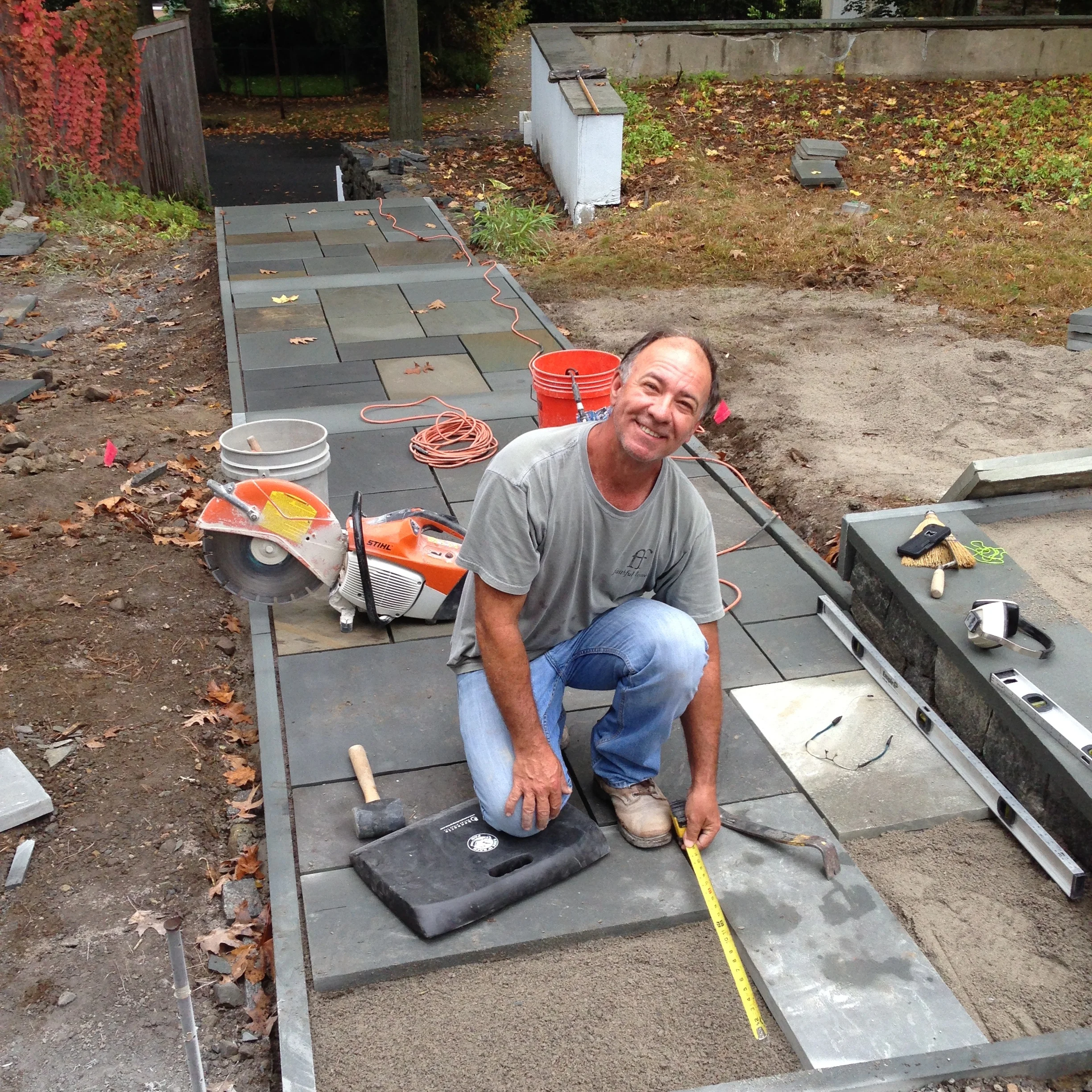 Luiz places each stone with thought and care for the overall design.