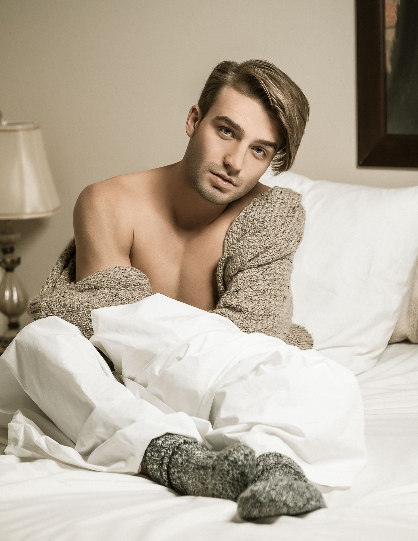 What I love about this is how it evolved from amateur status to a professional one. Back in college, I had to take a photography class to get some art credit. Using friends, I did a similar series that glamorized daily activities. Here we are now, with a gorgeous model in bed whose socks had to be styled in a particular manner with the cardigan sweater of choice.