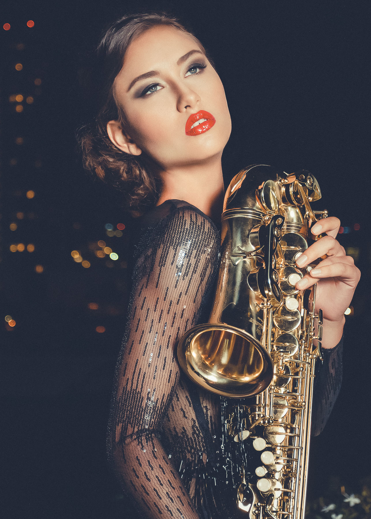 Musical madness. It was getting dark fast. We had one more look to go. It was hectic since we were shooting on-location in San Diego with three models and a hair/makeup team that was falling behind. Not to mention, we had to do the location scouting just before the shoot. But we still somehow managed to pull this shot at the end of the night. Its just so seductive and glamorous.